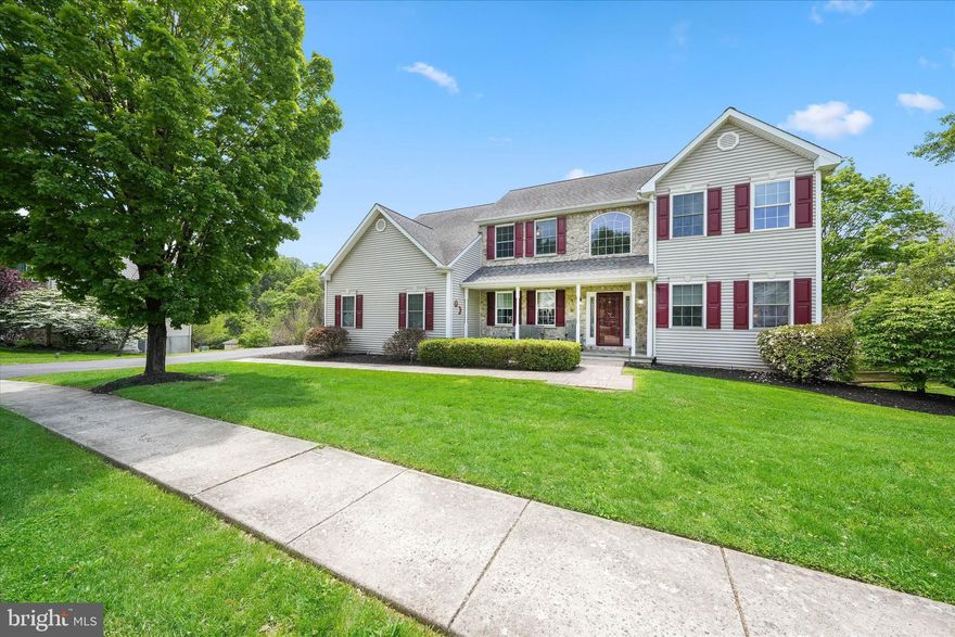 Welcome to 27 Twin Creeks Drive, a beautifully updated and meticulously maintained home in the highly desirable Mendenhall at Twin Creeks community within the award‑winning Garnet Valley School District. This spacious 5‑bedroom, 3 full bath, 2 half bath residence with a 2‑car turned garage sits on a premium corner lot and offers exceptional curb appeal, abundant living space, and an impressive oversized deck overlooking a private fenced backyard. Since 2019, the owners have completed extensive upgrades, including new hardscaping and path lighting, replacement HVAC systems, a whole-house Generac generator, new engineered hardwood flooring, a fully renovated kitchen, basement drop ceiling, and the addition of a main‑floor laundry room with half bath. A newer paver walkway leads to the expanded covered front porch and into the impressive two‑story foyer with turned staircase and elegant wainscoting. The main level features a bright formal dining room with chair rail molding and a living room with French doors and ceiling fan. A private office—also with French doors—offers abundant natural light and an ideal work‑from‑home setup. The renovated kitchen opens seamlessly to the great room and four‑season room, creating an ideal layout for everyday living and entertaining. Highlights include white cabinetry, granite countertops, herringbone backsplash, center island with breakfast bar, recessed and pendant lighting, stainless‑steel appliances, double sink, built‑in desk area, and two pantry closets. The adjoining great room features a gas fireplace with mantel and built‑ins, crown molding, chair rail, recessed lighting, and ceiling fan. The four‑season room features skylights, decorative windows, and access to the upper and lower teak decks—perfect for relaxing or hosting gatherings. A tucked‑away outdoor storage area sits beneath the four‑season room. Two powder rooms are conveniently located on the main level, including one adjacent to the office and great room, and a second combined with the laundry room. A bonus hallway with double closets leads to the attached 2‑car turned garage with built‑in cabinetry. Upstairs, a spacious landing leads to five generously sized bedrooms. The oversized primary suite includes a flexible sitting/dressing area, recessed lighting, ceiling fan, and two walk‑in closets. The ensuite bath features a soaking tub, separate shower, and double vanity. Four additional bedrooms offer large closets, and the hall bath includes a double vanity and tub/shower. A floored walk‑in attic provides excellent additional storage. The finished walk‑out basement expands the living space with areas for recreation, media, storage, a full bath, and a SECOND laundry room with wash basin. French sliders open to the backyard and custom paver walkway. Unique hidden storage areas are located throughout. Additional features include six‑panel doors, two staircases to the second floor, recessed lighting throughout much of the home, a new driveway, and extensive storage options inside and out. Ideally located near parks, restaurants, and shopping—including The Shoppes at Brinton Lake, Glen Eagle Square, and Wegmans—this home also offers easy access to Routes 1 and 202, I‑95, Philadelphia International Airport, Amtrak, and SEPTA, making commuting to Philadelphia, Wilmington, New York, and Washington, DC exceptionally convenient. A rare opportunity to own a beautifully updated home with flexible living spaces in one of Delaware County's most sought‑after communities—add 27 Twin Creeks Drive to your tour list today.