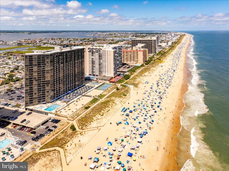 Oceanfront Living at Its Finest in Golden Sands! Discover this stunning 2-bedroom, 2-bathroom condo in one of Ocean City's most sought-after high-rise buildings. Enjoy breathtaking panoramic views of the Ocean from your balcony, perfect for morning coffee or evening relaxation. The spacious, light-filled living area offers ample seating and a sleeper sofa it also features floor-to-ceiling windows that let the natural beauty of the coastline shine through, while the open-concept design seamlessly connects the living room to a well-appointed kitchen—ideal for dining and entertaining. The master bedroom includes a king sized bed with ocean views. The second bedroom is complete with two full size beds. Golden Sands offers resort-style amenities including direct beach access, a large outdoor pool, Pickle ball, Volley Ball Court, tiki bar,  the 22nd floor offers a heated indoor pool, fitness center, game room, a mens and women's locker rooms with saunas and shower and more. Located minutes from Ocean City's restaurants, shopping, and entertainment, this condo is a dream for both year-round living and vacation getaways.