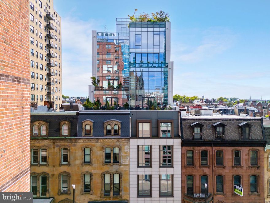 Discover the pinnacle of refined city living on the 6th floor of 2110 Walnut Street, an exquisite boutique condominium that effortlessly fuses timeless character with modern sophistication. A sleek reimagining of Philadelphia’s iconic brownstones, this 10-story residence seamlessly integrates into the historic fabric of Rittenhouse Square. Designed by the acclaimed architect Cecil Baker, 2108-10 Walnut Street offers low condo fees, secure, on-site indoor PARKING, a storage room (with no additional fees), and approximately six years remaining on the TAX ABATEMENT. This sprawling 3,670-square-foot residence boasts 4 bedrooms and 4.5 bathrooms, featuring captivating city views from three exposures that fill the home with natural light throughout the day and deliver breathtaking evening panoramas from every angle. Step out of the private elevator and into an inviting foyer that opens into an expansive living area, perfectly designed for both relaxation and entertaining. The custom Scavolini Italian kitchen is a chef’s dream, complete with quartz countertops, Wolf and Sub-Zero appliances, a built-in wine refrigerator, and a state-of-the-art coffee system. High-end fixtures from Duravit, Dornbracht, and Grohe further enhance the kitchen’s luxury.  Enjoy casual dining at the spacious island, soak in the stunning views from the kitchen table, or host gatherings on the sprawling terrace with sweeping cityscapes. The tranquil master suite offers ultimate privacy, tucked away at the rear of the home, overlooking the picturesque tree-lined Chancellor Street with serene southern views. The suite features a custom walk-in closet by Pianca and an indulgent en-suite bath with a standing steam shower, waterfall showerhead, and radiant heated floors—creating a spa-like retreat in the heart of the city. Each additional bedroom is generously sized, complete with its own en-suite bathroom for maximum privacy and comfort. This meticulously designed condo also boasts 10-foot ceilings, wide-plank oak floors, floor-to-ceiling windows, recessed lighting, and a Nest thermostat system. Additional standout features include cutting-edge built-in lighting, elegant custom wallpaper, and designer fixtures. This home epitomizes contemporary luxury and thoughtful design, seamlessly blending style with functionality. Don’t miss the opportunity to live in one of Philadelphia’s most coveted boutique condominiums, offering a unique combination of urban convenience and historic charm. Situated close to 30th Street Station, UPENN, Drexel, and just steps away from Rittenhouse Square, The Fitler Club, premier dining, and with easy access to Route 76 and 676. *This condo includes 1 deeded, on-site garage parking space. Additionally, the seller is offering a credit for the installation of a parking lift in the garage, allowing for 2-car parking, or alternatively, a credit equivalent to 2 years of prepaid parking at a nearby lot. There are multiple parking options available within a half-block to 2-block range. This offer is contingent on receiving an acceptable offer.*
