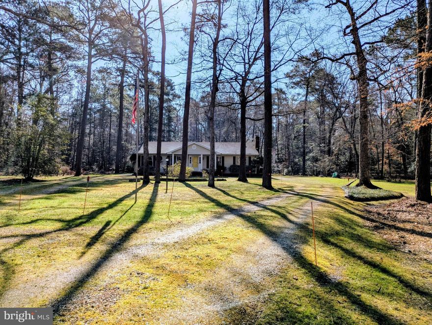 Drive down a country lane surrounded by farmland & woods to the lovely neighborhood of Bantry.  Enjoy your own 5+acres with a circular driveway & scenic surroundings. Welcome to your single level home w/ full front porch, lots of decking & a warm  interior.  Gather around the fireplace or enjoy a window filled great room w/  wood burning stove & access to extensive decking which overlooks the landscaped yard & trees.  Gather around the breakfast counter or sit at the dining room table.  Take refuge in one of the 3 bedrooms, including a primary suite with walk-in closet & in suite full bath.   Or grab your boat, kayak or paddle board & venture down to the community boat ramp & pier.  Or just walk or bike down & enjoy the views.  Downtown Easton,  Easton Airport, stores, the new hospital, Rte 50 & the Bay Bridge are just a short ride away.  Reconditioned crawl space.  Laundry room w/ commode, sink built-ins & closet.