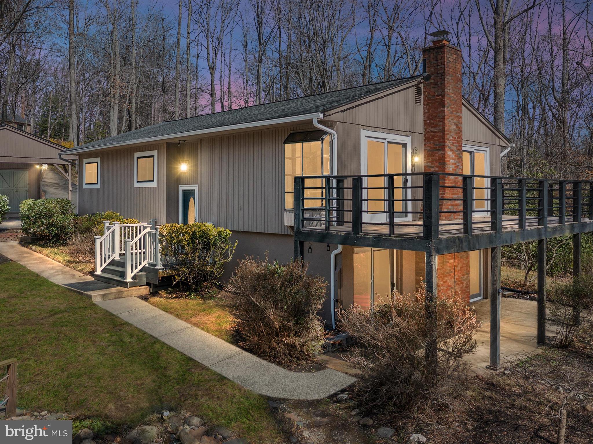 This stunning Split Foyer is a true gem, offering a perfect combination of modern upgrades and peaceful seclusion. Nestled in a completely private setting surrounded by beautiful woods, this home features hardwood floors and LVP flooring throughout, providing both style and durability. Recently upgraded with new appliances and freshly painted interiors, the home is ready for move-in. The updated bathrooms reflect modern design and functionality, creating a fresh, inviting atmosphere. The home offers two spacious living room options, including a cozy lower-level family room, ideal for entertaining or relaxation. The lower level also includes a full bathroom and a bedroom, making it perfect for guests or additional privacy. A huge laundry room with ample storage ensures you have plenty of space to stay organized. Step outside and enjoy the tranquility of nature from the upper-level balcony or the walk-out patios, offering easy access to the serene surroundings. The primary suite is a true retreat, complete with its own private balcony for ultimate relaxation. This home provides the perfect balance of comfort, style, and privacy – a must-see property! Close to Annapolis and easy commute to DC or Baltimore. Rental requirements: Annual Salary $125,000 + ; 650 + Credit Score; 5 Year Work & Rental History (if applicable); Credit & Background Check.