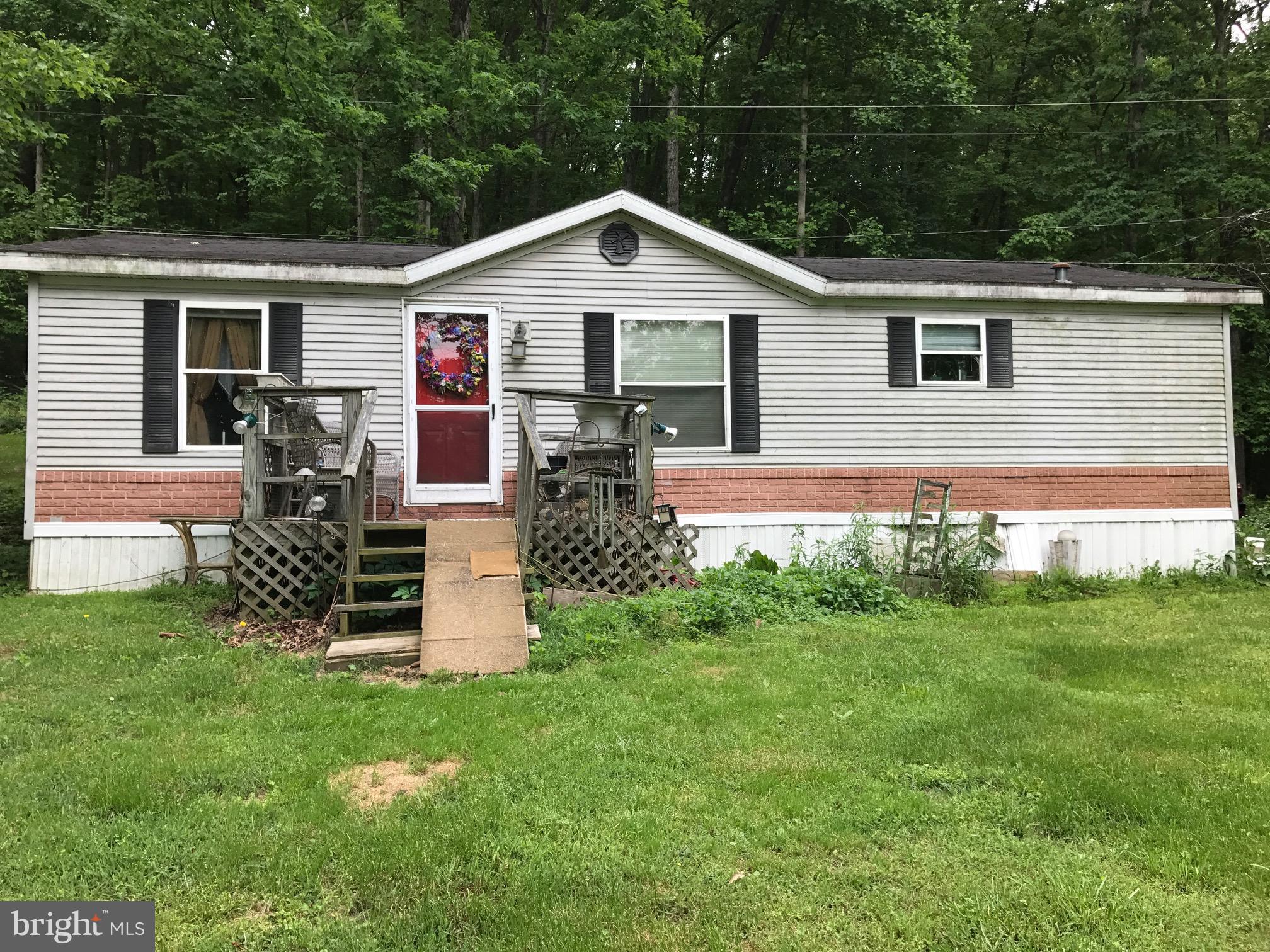 1999 Double wide trailer that features three bedrooms, two full baths, and located close to the MD and VA corridors. Investment potential/rental potential and property is situated on 1/3 acre of land.