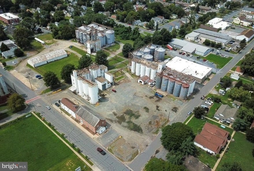 6.54 Acres: One of the largest land parcels in downtown Easton.  Available as a redevelopment project or as raw land. Potentially modeled after the nearby smaller silos at the Perdue Needwood site, with a phenomenal, market-supported, value-add component of repurposing the existing structures to create housing (be sure to see the video).  PR Zoning allows for redevelopment and rehabilitation of current properties that no longer serve their original use, with potential for up to 60 units per acre!