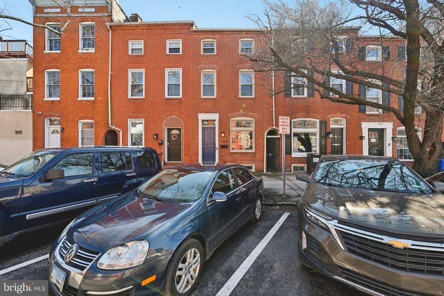 Welcome to 1737 Bank Street in Fells Point!This beautiful home is full of character, featuring exposed brick and beams that highlight its historic charm. Flowing hardwood floors lead you through the thoughtfully designed living spaces.The gourmet kitchen offers stainless steel appliances, a pantry, and the convenience of an in-unit washer and dryer. With 3 bedrooms and 2½ baths, there’s plenty of space for comfortable living.
Enjoy the private rear patio — perfect for relaxing or entertaining. Ample nearby parking adds to the home’s everyday convenience. ideally located close to Johns Hopkins Hospital, just a short stroll to the Fells Point waterfront, shops, and restaurants. Easy access to I-83 and I-95 makes commuting a breeze.