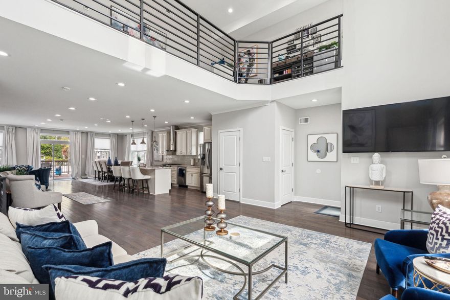 Step into this stunning home and discover a spacious open-concept first floor. The living room features soaring ceilings and oversized front windows that fill the space with natural light. A powder room is conveniently located just off of the living area. The layout flows seamlessly into the chef’s kitchen, outfitted with granite countertops, stainless steel appliances, and a generous amount of cabinetry. Toward the back of the home, there's a dedicated dining area along with an additional seating nook. From here, step directly out to the rear deck — the perfect spot for grilling or relaxing outdoors. The lush yard features a cozy seating area surrounding a built-in gas fire pit — the ideal space to gather on cool evenings.
On the second floor, a lofted lounge offers a versatile hangout space. The hallway includes a laundry area for added convenience. The luxurious primary suite features two expansive closets and large windows that bring in tons of natural light. The en suite bathroom includes a double vanity, soaking tub, and a spacious walk-in shower.
The third floor includes four well-sized bedrooms, each with ample closet space. The two middle bedrooms share a Jack-and-Jill bathroom with a double vanity and a large linen closet. An additional full hallway bath completes the level.
At the base of the stairs to the roof deck, a sleek wet bar makes entertaining easy. Upstairs, the rooftop offers city skyline views and plenty of room to relax or host guests.
The fully finished basement provides extra living space and interior access to the two-car garage, which includes two sizable storage closets.
Located near Fairmount Park, St Joseph’s University, and with easy access to public transportation and the interstate, you don’t want to miss this one. Schedule your tour today!