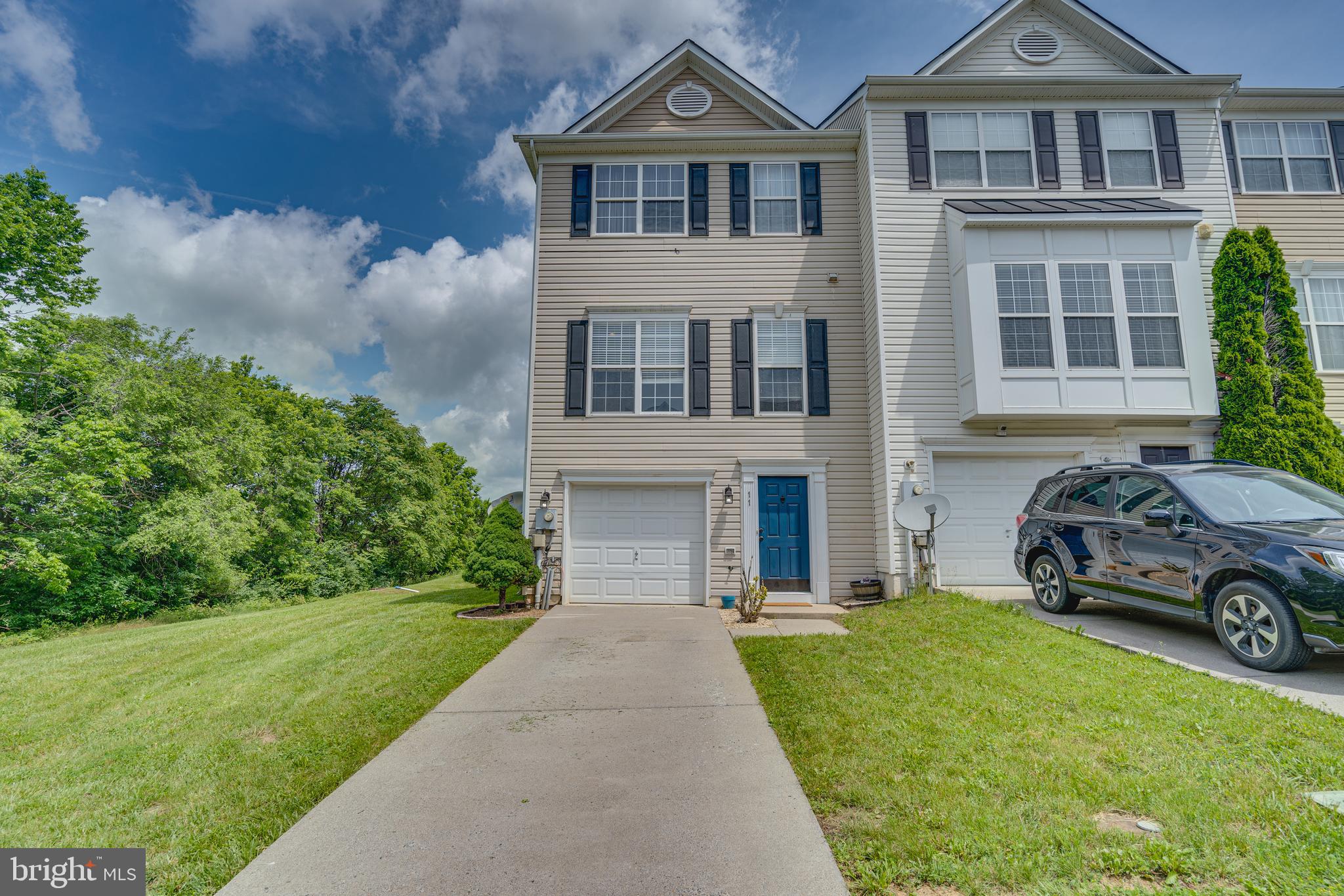 This stunning 3-level end unit townhome, located at the end of a quiet street. Being an end unit, this townhome enjoys extra privacy and natural light with additional windows. The well-maintained community features beautiful landscaping, sidewalks and the home includes an attached garage and additional parking spaces. Entrance on the lower level offers a versatile family room or recreation area, a half bathroom, and walkout access to a charming patio area under the deck, perfect for entertaining or relaxation. As you enter the main level, you’ll be greeted by an open-concept living and dining area bathed in natural light. The kitchen features beautiful granite countertops, stainless steel appliances, and ample cabinetry and a corner pantry making it a delight for any home chef. A convenient half bathroom is also located on this level, along with access to a spacious back deck, perfect for seamless indoor-outdoor living. The upper level boasts a luxurious master suite complete with an en-suite bathroom and ample closet space. Two additional bedrooms, each with generous closet space, and a full bathroom and provides plenty of room for family or guests. This property could also be utilized as an investment property for rental income. 11 Hokes Run Rd is located in a desirable neighborhood with easy access to local amenities, schools, and parks. Schedule a private tour today and make this your new home!