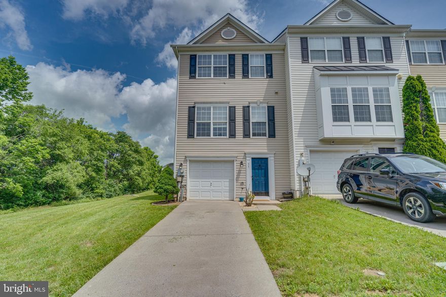 This stunning 3-level end unit townhome, located at the end of a quiet street. Being an end unit, this townhome enjoys extra privacy and natural light with additional windows. The well-maintained community features beautiful landscaping, sidewalks and the home includes an attached garage and additional parking spaces. Entrance on the lower level offers a versatile family room or recreation area, a half bathroom, and walkout access to a charming patio area under the deck, perfect for entertaining or relaxation. As you enter the main level, you’ll be greeted by an open-concept living and dining area bathed in natural light. The kitchen features beautiful granite countertops, stainless steel appliances, and ample cabinetry and a corner pantry making it a delight for any home chef. A convenient half bathroom is also located on this level, along with access to a spacious back deck, perfect for seamless indoor-outdoor living. The upper level boasts a luxurious master suite complete with an en-suite bathroom and ample closet space. Two additional bedrooms, each with generous closet space, and a full bathroom and provides plenty of room for family or guests.  This property could also be utilized as an investment property for rental income. 11 Hokes Run Rd is located in a desirable neighborhood with easy access to local amenities, schools, and parks. Schedule a private tour today and make this your new home!