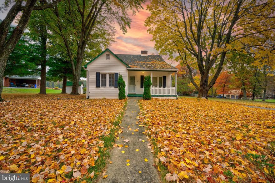Offers due by 5:00pm Sunday 10/30/22.  Quaint home with central air offering 2 bedrooms and 1 full bath, eat-in kitchen and living room with wood burning fireplace.  Hardwood floors under carpet.  Stairs to unfinished attic space/extra storage area.  Unfinished basement with laundry.  Enjoy the beauty outside on the front porch.  Cute little side porch, fenced in area that was once a large garden, small storage shed and medium size storage shed that offers electric, could be office/studio, art room, etc. Driveway space for 4-5 vehicles.  New water heater in 2021, Selling AS-IS.