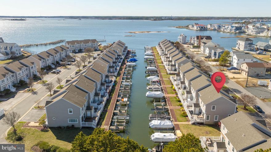 **Experience Premier Waterfront Living in Ocean City, MD!**

Welcome to this stunning canal-front end-unit townhouse, offering the ultimate coastal lifestyle with breathtaking water views and direct access to the Assawoman Bay. Whether you're a boating enthusiast or simply love serene waterfront living, this two-story gem has it all—including a private dock with a *brand new boat lift cradle rated for 8,000 lbs*.

🏡 **Highlights Include:**

* 3 spacious bedrooms | 2.5 bathrooms
* Light-filled open-concept living area with large windows and canal views
* Renovated guest bathroom with stylish finishes 🛁
* Updated appliances including refrigerator and full-size stackable washer/ dryer
* Expansive deck with *brand new self-retracting Sunbrella shade*—perfect for morning coffee or sunset cocktails 
* Dedicated deck storage closet for beach and boating essentials
* End-unit location for added privacy and natural light

Just minutes from Ocean City’s award-winning restaurants, iconic boardwalk, sandy beaches, and vibrant nightlife, this home is ideal for year-round living or the perfect weekend retreat.

✨ *Don’t miss this perfect waterfront opportunity in one of the East Coast’s most sought-after destinations. Schedule your private showing today!*