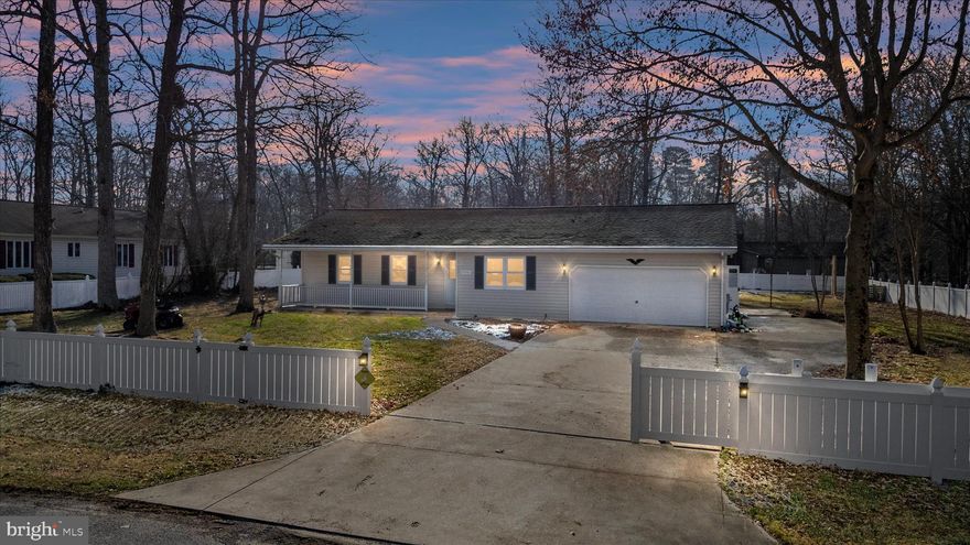 Water privileged, privacy and lots of space, over 1,800 sqft with 3 bedrooms and 2 full baths. You won t want to miss this one. Lots of space for entertaining inside and out. Inside you will find new floors in kitchen and laundry room, recently purchased stainless appliances, fresh painted walls, updated bathroom, large open floor plan, and a sun room overlooking the large, fenced-in yard. Outside includes concrete driveway with ample parking and room for boat/RV, and two car garage with extra lighting. All within walking distance to community water access on the Choptank River, so bring the canoes or kayaks and claim this beauty before someone else does! Call today for more info!