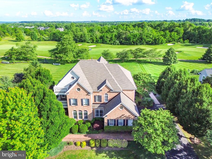 Welcome to beautiful and bucolic Raspberry Falls, one of Loudoun County's premier neighborhoods centered around the award-winning Gary Player designed golf course.  With its rolling hills, expansive open spaces, gorgeous homes and generous lot sizes, Raspberry Falls offers a rare retreat from the hustle and bustle of Northern Virginia while being within 10 minutes to historic downtown Leesburg.  

Situated on one of the prettiest lots in the neighborhood, this home overlooks the 16th fairway and green of Raspberry Falls Golf and Hunt Club.  Its wide, south-facing and completely flat rear yard is perfect for a future pool to create incredible memories in the years to come.  

The main level offers a formal dining room with extensive molding, separate living area perfect for quiet conversations & a home library with built-in shelving accessed by French doors.  The gourmet kitchen offers light cabinetry, granite counters with an island plus breakfast bar area, stainless steel appliances, a sun-soaked morning room surrounded by windows to take in the gorgeous outdoor views and is open to the large family room with coffered trim ceiling and a wall of windows for those incredible views.  A second office is perfect for those who need additional "work-from-home" space yet is also attached to a fifth full bath for those families who prefer a main-level bedroom with ensuite full bathroom, while a private door leads to a covered porch.  The family room leads out to the expansive patio, surrounded by lush landscaping, extensive hardscaping, knee walls and a wood-burning fireplace for those summer and fall evening get togethers.

The upper level offers five generously sized bedrooms and four full baths.  The primary bedroom offers a panoramic view of the golf course and hills beyond, a separate seating area that leads to a private balcony, perfect for a night cap or morning coffee.  Step up to the ensuite wet bar and walk into the luxury private bath with two-person garden soaking tub, separate shower with seamless glass enclosure, separate vanities and an enclosed water closet, while separate walk-in closets provide ample closet space.   The second and third bedroom offer ensuite private full baths, while the fourth and oversized fifth bedroom share a Jack-and-Jill bath with double-bowl vanity.  

The lower level is literally award-winning, having won a regional award for its design and finishes.  A large wet bar overlooks several entertaining areas that include a sitting area warmed by a gas fireplace, an open movie theatre viewing area, separate game room with pool table and chairs.  Additionally, a large home gym with walled mirrors is perfect for those morning workouts, while a full bathroom is perfect for out-of-town guests who want to stay overnight.  

This is a home that will please everyone and is the perfect gathering place for family and friends to build years of lasting memories!   Contact listing agent and Raspberry Falls neighbor Matt Elliott for your private tour today!