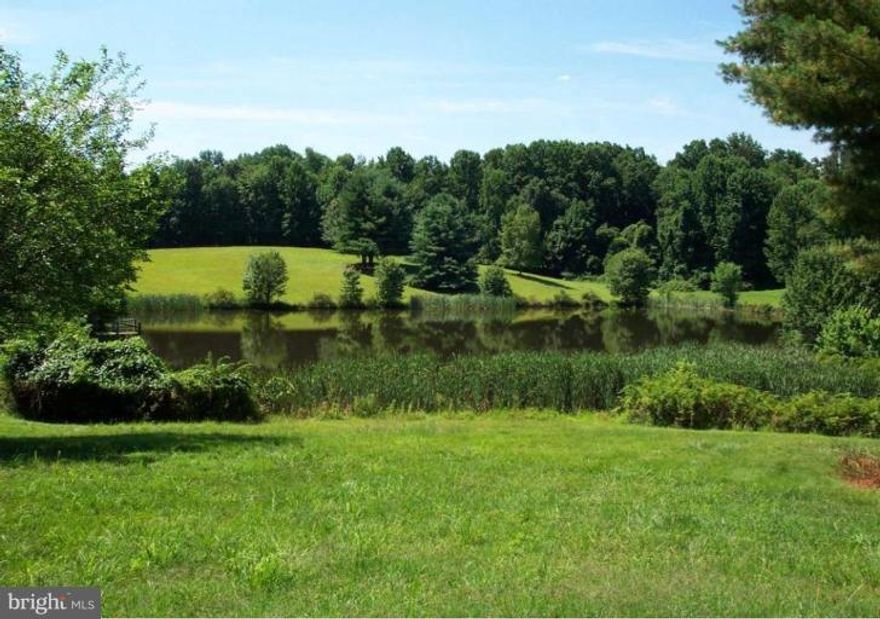 One of the last opportunities to buy and build in the exclusive enclave of estates at The Pond of Beach Mill. 5 of the most spectacular acres in Great Falls, with amazing unobstructed views across the pond, are available for your multi-million dollar estate.   The entrance is graced by an elegant stone and gated entryway. Adjacent 5 acre parcel is also available for purchase.