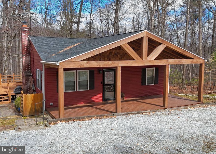 You’ll love this quaint and truly extraordinary 3 bedroom bungalow tucked back a private road on a secluded 3-acre wooded lot, with a small stream to the rear, and Michaux State Forest is just up the road.  The open central living space is certain to impress with a gorgeous brand-new kitchen with granite counters, large island, and new stainless appliances.  The living room is cozy and spacious with a beautiful stone hearth and woodstove.  New high-efficiency heat pump and a/c to make it comfortable and convenient all year long.  Outside are both an oversized front porch and rear deck to enjoy the outdoors and tranquility of this wooded setting.  Nice level rear yard.  Detached 24x14 heated 2-story garage/shed, well suited as a workshop, with a full size loft above set up with a sleeper sofa and great as an office or recreation space.  Separate 16x10 storage shed.  Great as a getaway destination or for all year long!