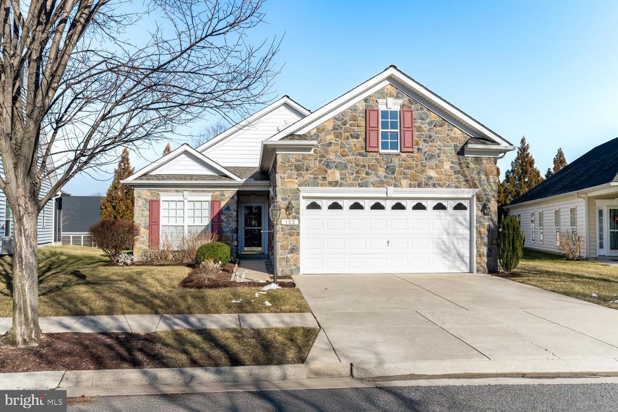 This beautiful Bach model home starts with a stone front exterior and a relaxing rear patio for outdoor enjoyment.  As you enter this true 3 bedroom, 2 full bath home that includes a front office (not counted as a bedroom) you'll be welcomed in with hardwood flooring leading past the formal dining room.  To the right as you enter, you'll find the main level laundry room with a pass through to the garage which includes a Sky Basement above and an interior TV antenna to get local channels.
Moving through the home, you'll find 2 bedrooms along with a full bath and coat closet.  The Gourmet Kitchen features a built in microwave, cooktop, double wall ovens, dishwasher, refrigerator and the kitchen island with Corriann counters.  Your eyes will be immediately drawn to the rear feature wall and the floor to ceiling stone gas fireplace.  The family room also includes plantation shutters and woven wood shades compliment the bedroom.  Of course you'll want to tour the Master Suite with the 2 walk-in closets and addition bump out.  The specially designed Master Bath features split vanity sinks, a large walk-in shower and a enclosed commode. 
This exceptional home also includes many upgrades starting from the time it was built adding Weather Smart House Wrap for temperature control, New Architectural Roof 2024, Tankless Water Heater, New 16 Ser HVAC 2022, UV Dust Filter on Furnace, Rear Irrigation System, Water Spigot in Garage and a Propane Line for a Patio Gas Grill.