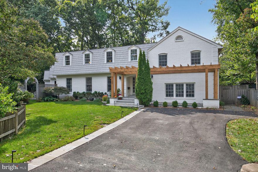 You’ve got to see it to believe it—first time on the market in 23 years! Set back from the street on a long driveway, this beautifully expanded and remodeled 4,330 square foot home offers a private, fully fenced yard with a sparkling pool and an unbeatable location just steps to Nottingham Elementary, Williamsburg Middle, and Yorktown High. Renovated by Whittington Design Studios with an airy, light-filled aesthetic, the main level showcases a show-stopping kitchen with a cathedral ceiling, an enormous 12-by-5 island that seats six, quartz countertops, three sinks, two dishwashers, two ovens, two refrigerators, a built-in banquette with seating for seven, and wide views of the pool. The kitchen opens to a gorgeous family room anchored by a glazed-brick fireplace and is complemented by two powder rooms—one with direct pool access—plus a sunlit office with built-ins and a living room/library lined with custom cabinetry and bookcases. Upstairs are four bedrooms including a spectacular primary suite with a 12-by-12 walk-in closet and luxurious spa bath, a large guest bedroom with an en-suite bath, two oversized secondary bedrooms, a hall bath, and a laundry room with extensive cabinetry. The above-ground lower level provides an enormous family room with multiple gathering spaces, a wet bar with beverage fridge, and a mudroom area. Premium finishes abound—Farrow & Ball paint, Thibaut wallpaper, Schumacher window treatments, and custom lighting—along with new windows, doors, roof, gutters, plumbing, electrical systems, and an electric car charger. The pool was re-plastered and re-tiled in 2023 with new bluestone decking and deck lighting, and the private backyard features a custom stone fire pit with boulder-stone seating for year-round enjoyment. Designed for every stage of life, this exceptional home is ready to be enjoyed with family, friends, and neighbors.