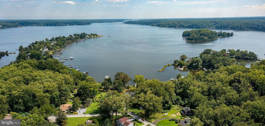 Half acre (.54) raw land parcel located in the water privileged Herald Harbor community.  Ideal setting to construct a new home.  The property is comprised of 9 lots which have been combined into (3) separate tax id's.   The property would require a septic system and the perc test has not been completed.   Bring your builder and build your dream home on this elevated setting.