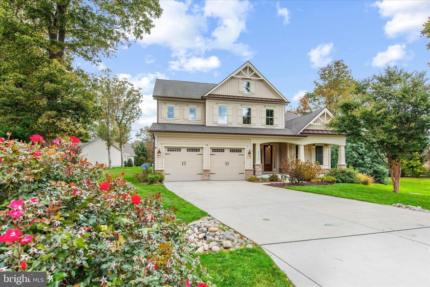 Nestled on a quiet cul-de-sac in the sought-after waterfront community of Bay Colony, this exceptional home blends coastal elegance with thoughtful design and premium upgrades. Freshly painted inside and out with refreshed landscaping, the home makes a striking first impression with its architectural peaks, board-and-batten shutters, and covered front porch framed by craftsman pillars. A rich wood-like entry door with glass side panels welcomes you into an interior defined by soaring ceilings, crown molding, and plantation shutters that fill the space with natural light. The grand living room impresses with a dramatic 26-foot ceiling, engineered hardwood flooring, and a cozy gas fireplace—perfect for gathering or relaxing. The gourmet kitchen is a chef’s dream, featuring a large granite-topped island, stylish pendant lighting, and GE Profile stainless appliances including double wall ovens and a five-burner gas cooktop. 42-inch soft-close cabinetry, under-cabinet lighting, pull-out drawers, and a walk-in pantry ensure exceptional function and storage. The main-level primary suite offers a peaceful retreat with a tray ceiling, expansive walk-in closet with an adjoining bonus room, and a spa-inspired bath with deep soaking tub, oversized shower, dual vanities, and private water closet. A front guest bedroom completes the first floor, while upstairs, two additional bedrooms (one en suite), a spacious loft, and a versatile flex room provide plenty of room for family and guests. Practical luxury continues throughout with an oversized two-bay garage featuring Pinnacle flooring, ceiling storage racks, and side access; a conditioned crawl space with dehumidifier; irrigation system with private well; central vacuum; tankless water heater; and a leaf-filter gutter system. The mudroom and laundry room offer thoughtful touches like built-ins, hooks, and a utility sink with Energy Star Samsung washer and dryer. Step outside to the covered composite deck and lower paver patio—ideal spaces for outdoor entertaining and relaxation. Bay Colony residents enjoy a gated marina with floating docks, boat ramp, and restrooms; a private beach; clubhouse; pool; tennis courts; and easy access to the Indian River Bay—just a short boat ride to Paradise Grill, Rehoboth, Dewey, Lewes, or Ocean City. Experience refined coastal living at its best—where luxury, lifestyle, and location meet.