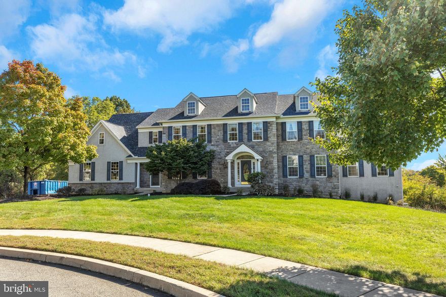 Welcome to this stunning 5-bedroom, 5.5-bathroom home, tucked away in the highly sought-after Wainwright at Whitemarsh Community, within the award-winning Colonial School District. This expansive property offers over 7,000 sq. ft. of finished living space (5,296 on 1st and 2nd floor | 2,207 on Above Grade Lower Level) and is situated on a private, Level lot that backs up to a beautiful nature reserve. As you enter, you’re greeted by a grand Foyer and staircase as well as an abundance of natural light, especially in the sun-drenched conservatory. The gourmet kitchen, a chef’s dream, features an oversized island, perfect for entertaining. Breakfast Room off the kitchen leads to oversized, wrap around Deck and Lower Level Paver Patio. Two Story Great room with gas fireplace is the heart of the home located off the kitchen/breakfast room. 5th Bedroom with en-suite and walk in closet finishes the Main Level, perfect space for an InLaw Suite or AuPair living quarters. The finished, above-grade walk-out basement provides even more space for recreation and relaxation. Basement features include a gas fireplace, full bath and 2nd Kitchen. The primary suite is a luxurious retreat, complete with a seating area, a spacious walk-in closet, and additional his-and-her closets. Every bedroom has its own en-suite bath, ensuring comfort and privacy for family and guests. This home also boasts a three-car garage and is nestled in a quiet cul-de-sac, offering both serenity and convenience. Close proximity to Blue Route (476) and PA Turnpike. Other upgrades include: Roughed In for 240 volt EV charger in garage, new generac generator (March 2022) and Newer Roof (Nov 2021). Don’t miss this rare opportunity to own a piece of paradise in a coveted location!