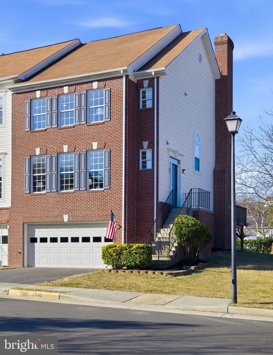 This spacious, brick-front end-unit townhome in Tavistock Farms features over 2,500 finished square feet and is one of only ten units in the community with a 2-car garage.  Discover the perfect blend of modern luxury and classic comfort in this rarely available end-unit in the heart of Leesburg.  Freshly updated in 2026, this residence is move-in ready and designed for those who appreciate fine finishes and abundant natural light.  Step across refinished hardwood floors into a home that feels new. The entire interior features fresh paint, complemented by new carpet in the bedrooms and lower level, and durable new LVT in the chef-inspired kitchen that is a true standout.  The heart of the home is the  kitchen, featuring new appliances, including a gas cooktop, dishwasher, and refrigerator. This vibrant space includes an eat-in area that flows seamlessly into a cozy seating in front of a wood burning fireplace.  The stunning wall of windows provides endless natural light. For formal entertaining, the connected dining and family rooms impress with soaring high ceilings, moldings and refinished hardwood floors .

The massive primary suite is a true sanctuary with dramatic vaulted ceilings and ample space for a sitting area, a large walk-in closet, a spa-like en-suite with double-door entry, separate vanities, soaking tub, and walk-in shower.

Enjoy the convenience of a rare 2-car garage and a versatile walk-out lower level. This bonus living area includes its own half bath and opens to a covered patio, perfect for outdoor relaxation.

Residents enjoy premium community amenities including a pool, tennis courts, and tot lots, all with close proximity to shopping and dining in Leesburg.

Showings start on Friday, February 6th.  Reach out to your Realtor now to book a private showing.