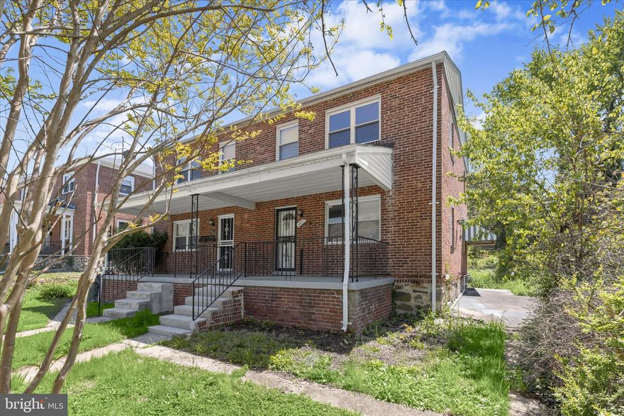 Beautiful brick end-of-row townhome ideally located near shopping, dining, and entertainment. A welcoming front porch leads into the main level, where hardwood floors and high ceilings create an open, airy feel that flows seamlessly into the kitchen. The kitchen is well-appointed with stainless steel appliances, granite countertops, and ample cabinetry, and provides direct access to the dining room. The dining area features updated flooring, a spacious closet perfect for pantry storage, and access to the backyard, ideal for indoor-outdoor living.  Upstairs, the primary bedroom is enhanced by a neutral color palette and updated flooring. Two additional bedrooms and a hall bath complete the upper-level living quarters. The partially finished lower level offers a cozy family room with knotty pine accents and open shelving, along with a storage area and convenient powder room.  Easy access to major commuter routes, including I-695, I-95, and I-83, ensures convenient travel throughout the region.