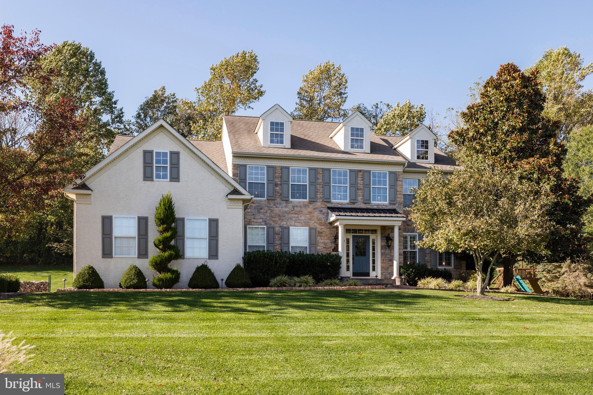This is it, the home you have been dreaming of! A luxurious modern farmhouse with 350K+ of recent upgrades on 1.1 acres in the coveted Haverhill neighborhood in bucolic Chester Springs. Elegant, yet comfortable, this pristine 5 bedroom, 4.5 bath home is ready for you to unpack your bags and start enjoying all this home has to offer. Featuring over 5600 square feet of living space, there is not one corner of this home that has been overlooked by the owner who runs a successful local interior design business. The first-floor features plantation shutters, refinished hardwood floors, and wainscoting throughout as well as accented shiplap walls. Enter a sunlit foyer with a new foyer chandelier with French doors which lead to an office/study. There is an open living room/dining room for easy entertaining. The kitchen was custom designed and built and there was no expense spared. Highlights of the kitchen include extensive cabinetry for storage, expansive island with butcher block, Thermador and Commercial Blue Star appliances, farmhouse sink, quartz countertops, tile backsplashes, custom copper and stainless Vent-A-Hood, coffered ceilings, recessed lighting, pantry, bar area with sink, separate beverage refrigerator, Scotsman ice maker and a farmhouse barn door which is entry to a wine/liquor room with another wine fridge. The coffered ceilings continue throughout the breakfast room and cozy family room with stone fireplace. Completing the first floor is a sitting room with outside entrance to the outdoor space and a fully remodeled laundry room with interior access to the 3 gar garage which has new barn style garage doors with smart app access and has been fully painted with epoxy floors, car mats and stops. The luxury finishes continue to the second floor where there are all new hardwood floors throughout, ceiling fans in every room, and all closets have been professionally remodeled for efficient utilization of storage space. The palatial master bedroom features plantation shutters, an accent shiplap wall, built in custom drawers, and his/her closets with custom cabinetry. The master bath was just remodeled this past Spring with a clawfoot tub, plantation shutters, marble tiled waterfall shower, barn door, marble vanities, beadboard, and beautiful gray planked floors. The 4 other bedrooms are all generous sized. The hall bath and guest bath have been fully gutted and remodeled within the past year which includes new flooring, fixtures, marble vanities, tubs, lighting, tile and shiplap accent wall. There really is no need to go anywhere. It is easy to entertain here with the expansive finished lower level and the fabulous outdoor area. Enjoy watching movies and sporting events on the large screen which is part of the High Definition built-in Marantz/Sony Home 102 inch entertainment system or playing a game of pool on the all wood pool table in the game room. There is a full bathroom for guests. Enjoy the fall/winter evenings in your private backyard in the Hot Springs salt water 500-gallon Grande hot tub after enjoying a meal made at your covered outdoor built-in Coyote Grill and Green Egg kitchen/bar. Afterwards, relax by your paver outdoor fireplace while listening to music from your theatre like self-amplified Sonos sound system with outdoor subwoofer. Other upgrades/updates not previously mentioned include new driveway, front walkway/steps, driveway landing and framed paver hardscaping, new HVAC, whole house built-in Generac, hot water system, new paint, sprinkler system, attic fan, radon system, outdoor lights, landscaping lighting package, whole house Sonos audio system with built in speakers through every master room . Located in the award-winning Downingtown School District and minutes from the PA turnpike, shopping, restaurants, train station, schools, Marsh Creek State Park, nature trails, and more this location is ideal. Quick Settlement is available.
