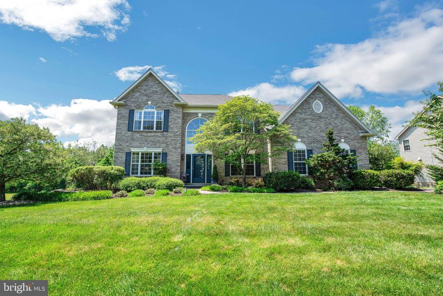 A gem is on the market! Step inside this meticulously maintained, one-owner property with 4 bedrooms, 3.5 baths, finished basement, home theater, inground pool with hot tub and so much more. This Raven Hollow executive home offers convenience and luxury in a private setting in the highly rated North Penn School District. Follow the lighted paver pathway and enter the freshly-painted grand 2-story foyer with hardwood floors, palladium window, crown molding and a turned staircase with new carpet.  Through the French doors to your right is a large study with new paint and carpet, recessed lighting and a modular desk system. To the left, a newly carpeted formal living room connects to a dining room with hardwood floors, chair rail and large windows. The heart of the home is the Mediterranean-inspired chef’s kitchen with solid cherry cabinets, granite countertops, tumbled marble backsplash, black on black appliances, center island with breakfast bar and recessed and under counter lighting – all designed for functionality and style. The large eat-in area has a sliding atrium door to a maintenance-free Trex deck for morning coffee or evening cocktails and a view with steps down to the spectacular outdoor living space. Back inside, the entertaining area continues to an adjacent family room with remote-controlled gas fireplace, wet bar and recessed lighting. The first floor includes a powder room, laundry room with washer, dryer and 2 closets. There is a 2-car finished garage with a Flow Wall organization system. Upstairs, French doors open to the owners' suite, an oversized private retreat with vaulted ceilings, sitting area and two spacious walk-in closets. The en suite bathroom boasts vaulted ceilings, a large palladium window, 6 foot whirlpool spa, walk-in glass shower and dual lighted vanities. The second floor is rounded out by three spacious bedrooms, each with large closets, a double linen closet and shared hallway bathroom with a skylight and double sink vanity. High-end lighting fixtures, custom window treatments and custom painting are featured throughout. Descend to the remarkable, newly-painted walk-out lower level, complete with a full bathroom and home gym that includes a multi-station fitness system, wall-mounted TV and Sonos sound. Prep for outdoor entertaining in the large central area that includes a mini kitchen with abundant cabinets, sink, dishwasher, microwave, stainless refrigerator, counter-height seating, and porcelain flooring. Play cards in the game room area complete with a wine bar and refrigerator. For movie lovers and sports enthusiasts, relax in reclining theater chairs to watch the action on a 100 inch wall-mounted screen in the dedicated home theater equipped with a Sony 4K projector system, Dolby Atmos surround and Sonos. There are four large closets for storage. Finally, step outside to your own private resort! With southern exposure, this spectacular area has a 1,000 sf paver patio, heated inground pool and spa, covered pergola with fan and light, paved walkways, light pillars and outdoor speakers. The custom landscaping includes dune-inspired grasses and pollinator, cutting and kitchen herb gardens. Family and friends can join the fun directly from the driveway where they will descend the paved and lushly planted entryway to arrive at this backyard oasis. Outside the fenced pool area is an organic raised-bed vegetable garden, fruit trees and a large yard backing to tree-lined township open space along the Little Neshaminy Creek. This home is move-in ready with many upgrades including Rub-R-Wall waterproofing, hard-wired security system, hot water heater with leak detection and auto shut off, new roof (2020), renovated pool (2020), dual zone HVAC (2022) and so much more. By the way, the walls are custom painted. Just a short walk to Windlestrae Park and close to shopping, 309, 202, and the PA turnpike, this is everything you’ve been looking for and more. Come and see your dream home!