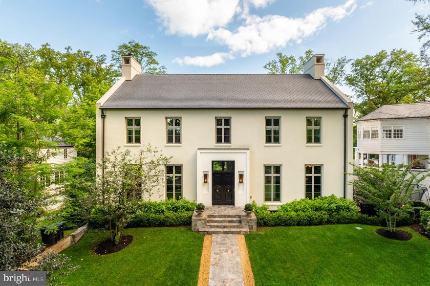 4929 Lowell Street NW is a remarkable residence on one of Kent's most beautiful streets. Thoughtfully designed and expertly crafted, the home boasts many hard-to-find features including 11+' ceilings, a Heated Salt Water Pool with Cabana, and a Deluxe Gym. Constructed in 2018, 4929 Lowell St NW is a modern Georgian-style Colonial that spans approximately 7,436 square feet and showcases a total of 7 Bedrooms, 7 Full Baths, and 2 Half Baths. Its architectural beauty begins with its symmetrical design and captivating curb appeal. Each carefully considered stone selection, tile choice, lighting feature, and wall dressing was meticulously chosen to curate a space that immediately embraces you. The rooms boast incredible scale and are lined with landmark elements of timeless design like custom plaster cove molding. From the super-wide plank distressed white-oak flooring to the detailed window trim and accent molding, each space is an experience that you will not forget. Set on a quarter of an acre in Kent, this home is a warm-weather wonderland with its sensational 15' x 33' Pool, a fieldstone Patio with a built-in grill, a Sun Deck, and a Cabana for poolside entertaining. There is a detached 2-Car Garage with a discreet rear driveway.