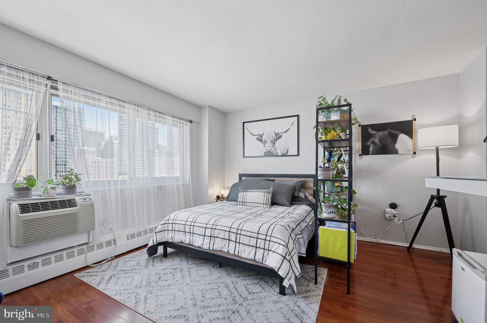 Enjoy sweeping cityscape views and convenient city living from this lovingly maintained studio condominium with ALL UTILITIES included. This home features premium unobstructed eastern exposures and views of the Center City skyline. The kitchen nook has been updated with newer appliances, gas range, microwave, and additional cabinet storage. The living area is well-proportioned and features a huge walk-in closet, perfect for storage. River West Condominium is a pet-friendly building and the monthly fees include a 24-hour front desk, secured entry, fitness center, resident's lounge, on-site management, and ALL UTILITIES (gas, electric, water, and heat). The building also has direct access to a private parking garage, with monthly garage parking at an additional fee (based on availability). Located in the Rittenhouse Square neighborhood, this home is blocks away from some of the best of Philly's dining and retail scene, world-class museums and cultural attractions, and is convenient to public and mass transit, Penn, Drexel, and more!