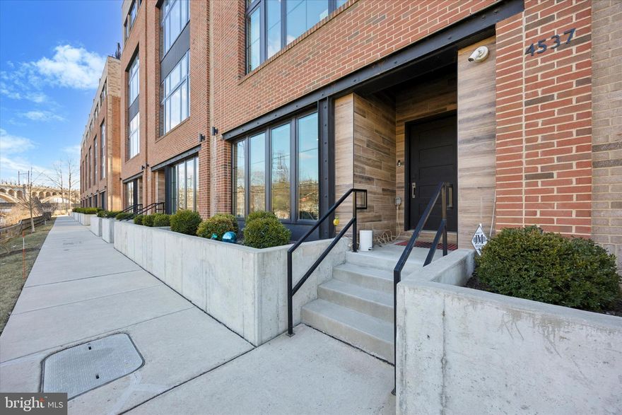 Experience modern luxury waterfront living on Venice Island in Manayunk, just a hop skip and jump away from Center City. This beautiful home offers unobstructed views of both the Schuylkill River and Manayunk Canal. It is one of only 11 homes within The Locks community with this bonus feature and is 23 feet wide. Oversized windows throughout maximize the viewpoints and natural light. This lovely townhome blends high-end features with modern sophistication from top to bottom. The ground floor versatile space is perfect for a gym, office, den or game room. The second floor is ideal for entertaining. Enjoy the sleek kitchen with stainless steel appliances, large island and pantry closet. Adjacent to the kitchen are additional cabinets and a beverage refrigerator as well as a cozy space for breakfast or sitting area with fabulous river views. Enjoy the open concept dining room and living room plus convenient powder room. The third level boasts an ensuite guest room, two additional bedrooms, full bathroom and well-appointed laundry room. The primary suite on floor 4 is stunning and offers custom closets and built-ins, a private balcony, expansive bath with soaking tub, convenient beverage bar area plus a separate room for a den, office or nursery. An elevator provides easy access from level 1 to the rooftop terrace which offers 360 degree views. This home is conveniently located with easy access to Center City via car or train. Enjoy the short stroll to Main Street and downtown Manayunk. Here you will discover lots of dining, shopping and entertainment options. Live the life of luxury and convenience at The Locks!
