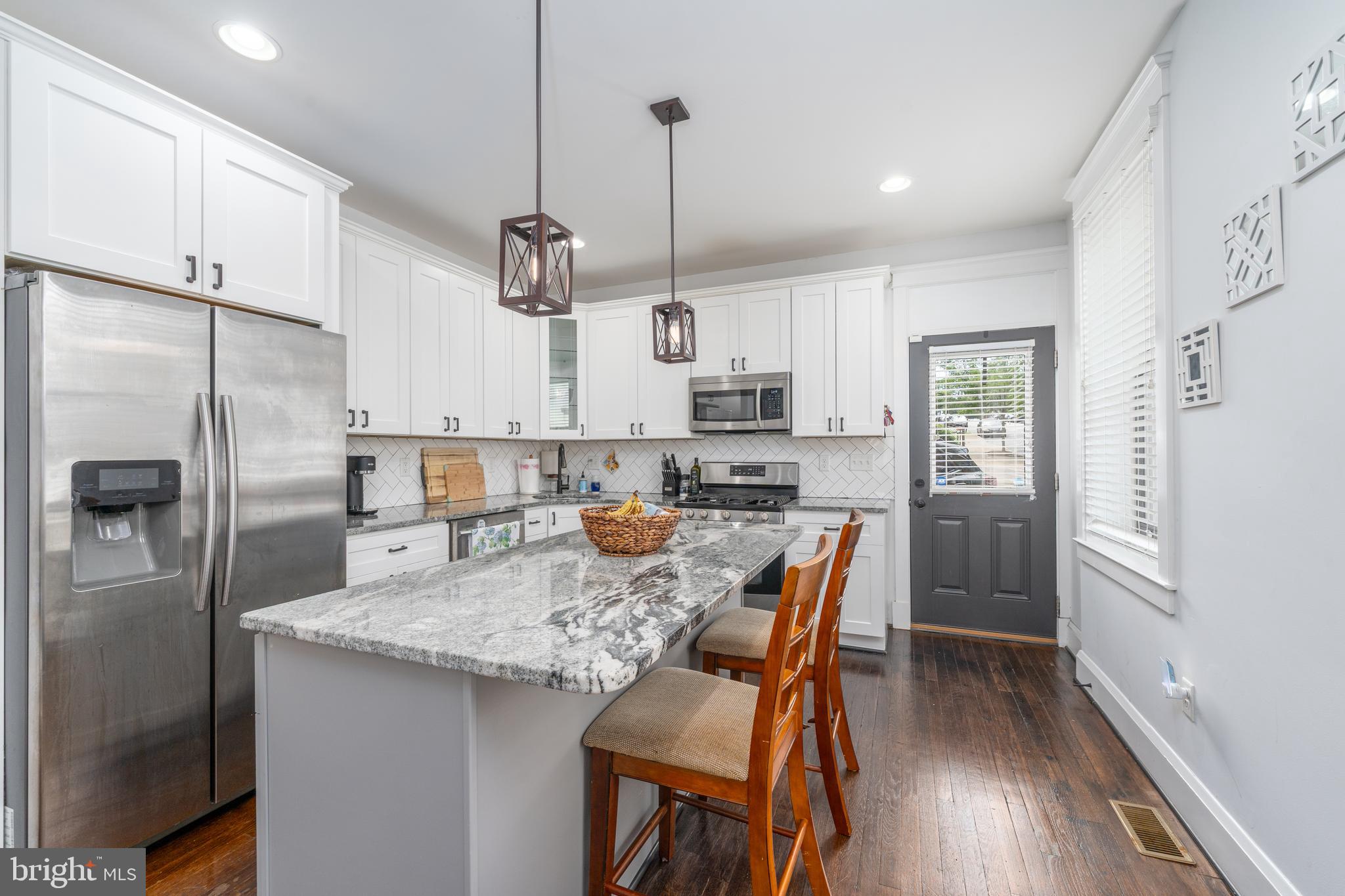 Welcome to this charming end of row residence nestled in the heart of Brewers Hill, with almost three years of CHAP tax credit remaining! This delightful and fully updated home spans almost 2,000 square feet, offering ample space for comfortable living as well as entertaining. With four spacious bedrooms and three well-appointed bathrooms, this property provides a perfect blend of style and functionality. Step inside to discover a warm and inviting atmosphere, highlighted by tray ceilings with recessed lighting to add a touch of elegance and comfort. The open concept floorplan flows seamlessly to the renovated kitchen, complete with gorgeous countertops, stainless steel appliances, and a large island. Whether you're hosting gatherings or enjoying a quiet evening at home, this will surely be an ideal spot for relaxation and enjoyment. The upper level provides a large primary bedroom with dual closets and a luxurious en suite bathroom, plus a second bedroom and updated bathroom. The lower level provides great additional space, with two additional bedrooms - or home offices - a third bathroom, as well as a separate laundry room. The off-street parking pad ensures easy accessibility, making daily life hassle-free. The convenient location provides a wonderful balance of urban convenience and residential tranquility, with local amenities and attractions nearby. This property is a true gem, offering a harmonious blend of classic charm and modern comforts. Don't miss the opportunity to make 600 S Eaton Street your new home. Experience the vibrant lifestyle of Baltimore while enjoying the luxurious comforts of this exquisite home. Buyer to verify CHAP credit. Contact us to schedule a showing!
