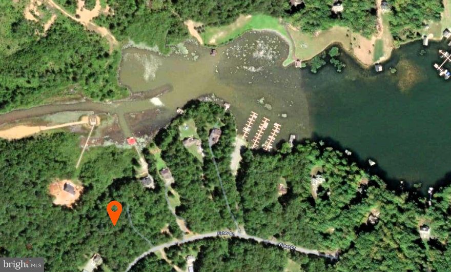Beautiful water access 2 acre lot on the public side of Lake Anna with assigned boat slip. Bring your builder, your plans and build your dream lake home! This wooded lot offers a gentle slope of the land that may accommodate a walk-out basement. The property backs to Dominion Energy shoreland and Contrary Creek. The convenient location of Freshwater Estates places you close to shopping, your favorite restaurants, micro-breweries, cidery, and the Cutalong golf course. The location on the water allows you easy access to the larger areas mid-lake, and local marinas.  There is 323 feet of property that backs up to Dominion Energy shoreland that doesn't mean there is 323 feet of waterfront.  Assigned Boat slip # 38 conveys in the Community Common Area. The gated Common area offers picnic tables, new pavilion and a recently extended boat ramp. This property is not on the Community Mass Drainfield, so the HOA dues are reduced. Be sure to walk this spacious lot and revel in its privacy and peaceful splendor.  Whether you're seeking to build your dream home, investment property or weekend getaway, this will be the perfect place to start living the lake lifestyle.  While it is possible to build a pier and boat house but you will need to apply for a permit thru Louisa County and have it approved by Dominion Energy.  This area of Contrary Creek would most likely require some dredging.  Water view would be dependent upon how many trees are removed.  POA fees are $350 per year.  2025 county property assessment is $120,000 and taxes are $864 paid annually.