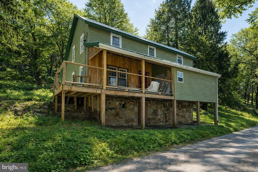 Step back to the early days of Deep Creek Lake with this 4-bedroom, 2-bath home full of character and potential. Renovations are underway but unfinished, making this a true handyman or contractor special. Connected to public sewer, the home offers a head start for completing the kitchen and bathrooms and adding custom finishes to create a one-of-a-kind retreat. Enjoy views of Deep Creek Lake and a prime location in the heart of the lake area, just minutes from Wisp Resort and all local attractions. A rare opportunity to restore and personalize a classic Deep Creek home.  This location is great, whether looking to make this a private residence, vacation home, or lake area rental investment.