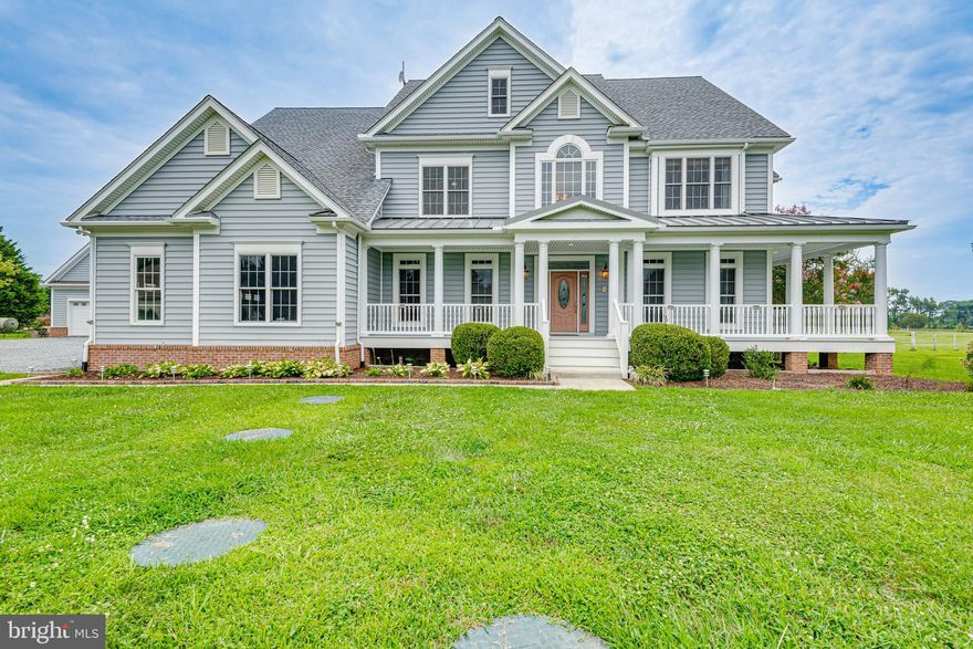 Meticulously designed and lovingly maintained custom built home in the heart of the Eastern Shore!  No detail was overlooked.  Grand entryway features hand-carved curved staircase and cherry hardwood flooring. Cozy up by the fire of the floor to ceiling stone fireplace framed by built-in shelving. Prepare your favorite meal in the gourmet eat-in kitchen! Quartz countertops, stainless steel appliances, two cooktops, double-wall oven, brand new raised dishwasher, and island with lots of cooking and storage space! Entertain in the formal dining room with built-in china cabinets. Laundry room with two front-loading washers and dryers, counter space, and sink is conveniently located between back door mudroom and oversized two-car garage entrance. Main level bedroom with slider to back deck.  Freshly painted throughout most of the house! Outdoor space includes expansive back deck and screened in back porch! Relax in style in your primary suite: sitting area with fireplace, mini-bar with fridge, and two walk-in closets. No need to go to the spa with this Primary Bath! Luxurious jetted soaking tub, separate walk-in shower with two shower heads, two sink vanities, and heated floors! Second bedroom features walk-in closet and private bath. Third and fourth bedrooms share a jack-and-jill bathroom, and what's this in the closet? No, it's not Narnia, but it is a bonus multi-purpose room! Fourth bedroom also has pull down stairs to  full, mostly floored attic space. Two Newer HVAC units! Main level bathroom recently converted from powder room to full bathroom with accessible shower. Unfinished basement is fully insulated and prepped for Hydronic Radiant Floor Heating! The features of this house don't end indoors! The 5 acre property also has a 2000+ square foot workshop with endless possibilities! Additional 2-car spaces, separate septic tank, and upstairs area than can be used as storage or finished into living space! Property also has goat pen and plenty of room for gardening. All this tranquility just minutes from Rte 50, making it highly commutable to Annapolis, Fort Meade, Baltimore, and DC! Convenient to shopping in Easton, Queenstown Outlets, or Delaware! This home is a must see!