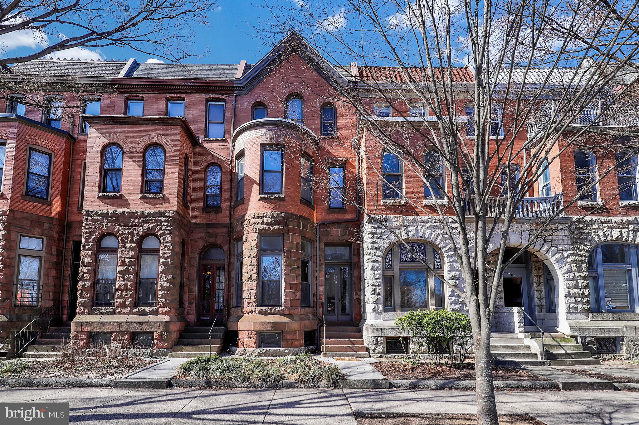 Get ready to be impressed by this stunning 4-bedroom, 2.5-bath Victorian in Bolton Hill! With over 3,500 sq. ft. of historic charm, this 1880-built beauty has been lovingly maintained, showcasing original hardwood floors, built-in shelving, and five decorative fireplaces that add warmth and character throughout. There’s plenty of space on every floor to fit your lifestyle! The home is kept cozy with comfortable radiator heat powered by a brand-new 2023 boiler. The second floor features two spacious bedrooms plus a bonus area—perfect for a home office, dressing room, or creative space—along with a shared full hall bath and a conveniently located laundry closet with washer & dryer. The third floor offers two more generously sized bedrooms and another full bath, making it ideal for guests or additional living space. Access to the huge, unfinished basement is out back through the Bilco doors. Storage galore as this space goes the entire distance of the house, front to back! Step outside to a charming brick-paved patio, fully fenced for privacy and perfect for entertaining. Beyond that, a parking pad that fits 2-4 cars—a rare find in the city! Located right across from MICA, this home puts you in the middle of everything—restaurants, coffee shops, green spaces, and easy access to transportation. Don’t miss out on this Bolton Hill gem! Better Hurry!