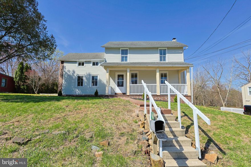 Located on a quiet street, this updated 1850s farmhouse offers a peaceful setting within the Emmaus Borough and the highly desirable East Penn School District. This home retains its authentic 19th-century footprint and character. Buyers who appreciate historic homes will note the original exposed beams, a traditional root cellar, lower ceilings, and the natural quirks of an 1850 build, including floors and doorframes that are not perfectly square. The home also features the original single-pane windows, and in keeping with the era's architecture, two of the three bedrooms do not have built-in closets. These historic details are paired with comprehensive modern upgrades. The main floor offers new flooring, a new half bath, a dedicated laundry room, and a completely remodeled kitchen with granite countertops, a tile backsplash, and brand-new stainless steel appliances. The second floor provides three bedrooms with fresh carpet and a newly renovated full bathroom featuring a modern stand-up shower. Major systems have been fully addressed for peace of mind, featuring updated electric and plumbing, supported by well water and public sewer. Outside, the property delivers excellent curb appeal with brand-new stucco, patterned sidewalks, and a freshly poured back patio. The 1/4-acre lot provides plenty of outdoor space for a garden or fire pit.