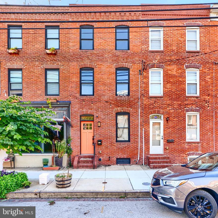 Welcome to this beautifully updated Locust Point home showcasing modern comfort and urban charm! This 3-bedroom, 3-full-bath residence offers the perfect blend of luxury and functionality, a true gem for those seeking an elevated lifestyle.  As you approach the property, the striking brick façade and extensive hardscape create an inviting first impression. Sitting on a newly updated roof, the meticulously designed roof deck provides a breathtaking vantage point to soak in panoramic city views, making it the perfect spot for entertaining or simply unwinding after a long day. Step inside to discover a harmonious blend of classic architecture and contemporary finishes. The interior boasts newlry refinished rich hardwood flooring that flows seamlessly throughout, creating a warm and inviting atmosphere.  The updated kitchen features sleek Viking appliances, ideal for any home chef. Walk up the second floor to find the large primary suite with a recently updated attached full bathroom. Just down the hall sits additional full bathroom and generously sized bedroom. The spacious third-floor bedroom includes a wet bar, creating the perfect space for entertaining or relaxing.  With the convenience of a large private parking pad for two and a location in the heart of Locust Point, you’ll enjoy easy access to restaurants, shops, and waterfront attractions—making this home the perfect city retreat!

Ask about our “BorrowSmart Advantage Program”. Choose Cazle Mortgage for your financing, and they will give you up to a 1% LENDER CREDIT towards your closing costs, based on your loan amount.