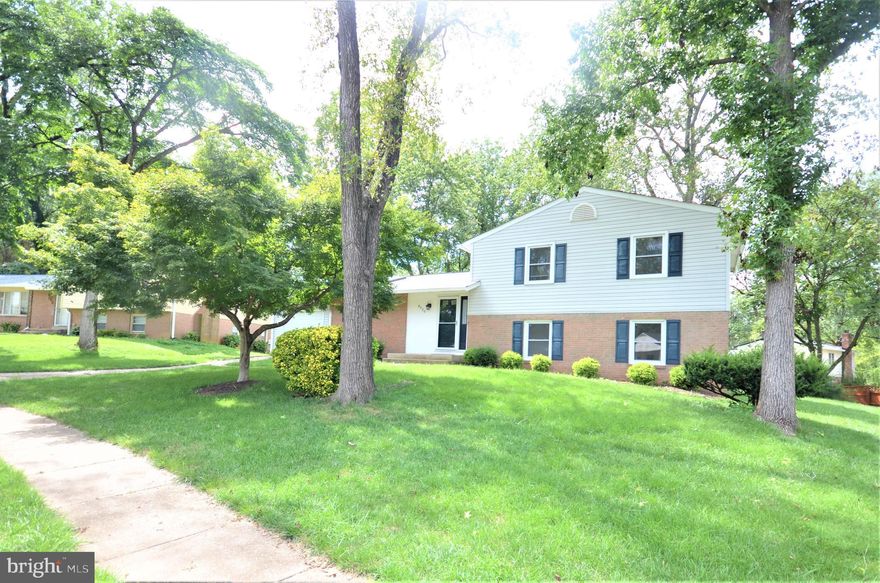 Spacious, Sundrenched Home-Great Location- Must see! Beautiful split level with hardwood floors, fresh paint, and skylights features a fully updated open kitchen with stainless steel appliances, granite, modern cabinets, and breakfast bar.  Main level enjoys an expansive living/dining area and a marvelous sun room leading to an impressive fully fenced back yard and full sized deck.  Upper level boasts a large primary suite with private bath, two guest bedrooms and full sized hall bath.  Lower level offers the fourth sun-kissed bedroom, third full bath, and walk-out level den.  Close to Pohick Creek Park & easy access to Fairfax Cnty Pkwy, Ft Belvior, 95/395.