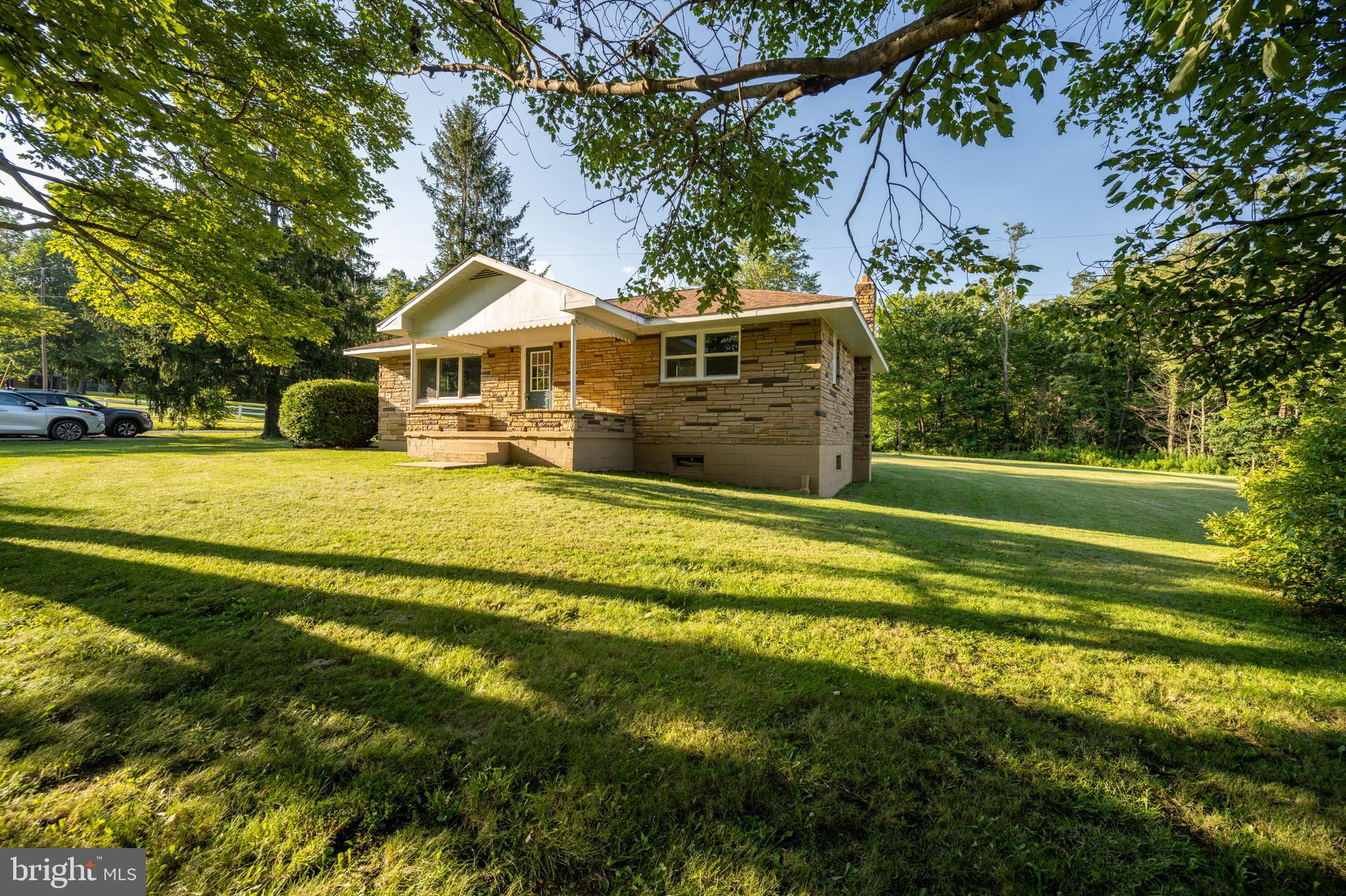 Welcome to this fully remodeled three-bedroom 1 bath, stack stone ranch nestled on just under an acre of countryside with stunning mountain views! Thoughtful modern updates throughout this property offer the perfect mix of charm, comfort, and functionality.
This move in ready home features a brand-new roof updated plumbing and electrical and modern finishes throughout The property includes a 24 -foot by 40-foot detached garage with cement floor that includes bases ready for car lifts ideal for automotive enthusiasts or a workshop set up. The spacious lot has room to garden expand or just enjoy outdoor living a rare combination of royal space functionality and scenic beauty this property is hard to beat!