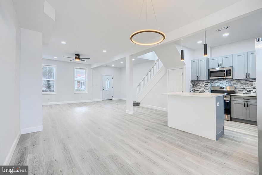 Wake up every morning, and say, I can’t believe I live in this amazing home! Open layout! Large Space! High Ceilings! Gorgeous kitchen with Quartz countertop and island, coordinating backsplash, wood shaker cabinets, and stainless steel appliances. Upstairs dual entry bath is elegant and comfortable and large, with Calacatta tile, custom tilework and designer plumbing and lighting fixtures. Fully finished basement features a family room and 4th bedroom which has a private full bathroom with custom tile shower. This home has a front porch, fenced in back yard, coordinated lighting and plumbing fixtures, new doors interior and exterior, recessed lighting, new HVAC system, Luxury vinyl plank flooring. You will love this home.