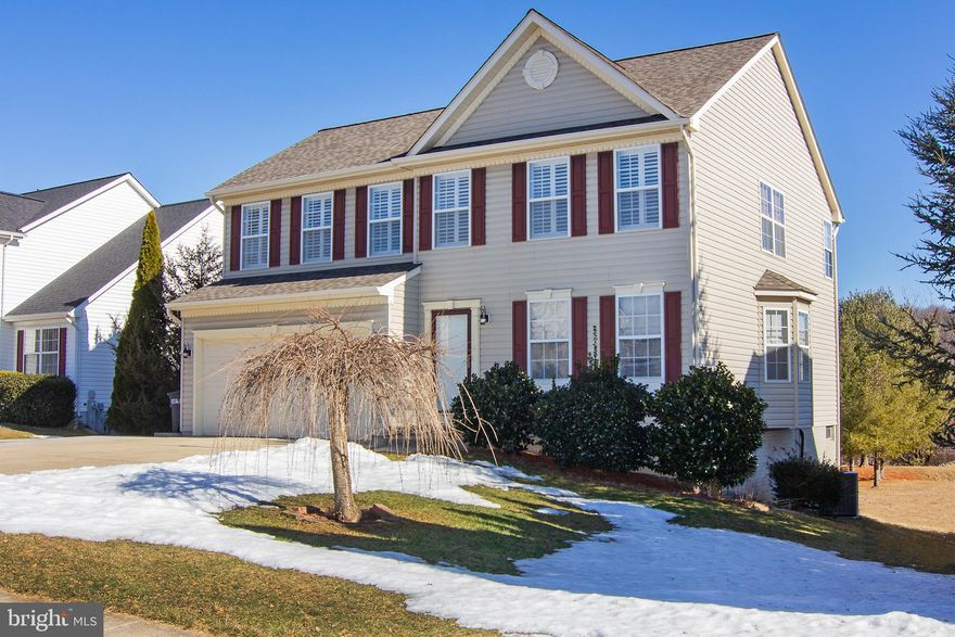 Beautiful finishes on this stunning colonial with an open floor plan. Many recent upgrades include: new roof*hardwoods throughout*3 updated full baths, even the lower lever, with ceramic, updated vanities, glass doors, dual shower heads in owners' bath*the home has been freshly painted*finished lower level with a walk out to rear yard*main level laundry includes washer/dryer*a large deck which overlooks open property*invisible fencing, and collars included*a family room with a gas fireplace and of course the kitchen. This stunning DREAM KITCHEN was upgraded in 2020 with custom cabinets, granite counters with a waterfall feature, a pantry unit, ceramic backsplash, a stainless farm style sink and upgraded stainless steel appliances. All this and Natural Gas and no HOA.