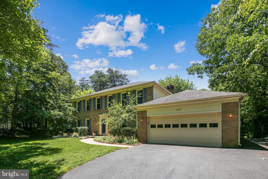 "NEW ON MARKET" in popular FRANKLIN FARM!!!  *  Updated Pulte "Williamsburg" Model on Private ONE ACRE WOODED HOMESITE!  *  "TREES! TREES! TREES!"  *  Spacious Entry Foyer with durable Slate Flooring and Oak Staircase  *  Main Level Study with French Doors and Built-In Shelving  *  Huge Formal Living Room and Separate Formal Dining Room  with Crown Mouldings and Chair-Railings/Wainscoting  *  Gleaming HARDWOOD FLOORING  *  RENOVATED, UPGRADED Kitchen featuring Granite Countertops, Center Island, Upgraded Cabinetry with inlaid roping detail and Crown Moulding, Under Cabinet Lighting, Kitchen Sink Garden Window, and NEW Stainless-Steel Appliances  *  Inviting Family Room with Recessed Lighting and Brick Fireplace and Propane/Gas Insert, Raised Brick Hearth, and Wood Mantle Shelf  *  Main Level Laundry/ "Mud Room" with access to Garage and exterior Side Entry  *  Primary Bedroom Suite Boasts Ceiling Fan, Recessed Lighting, Separate Dressing Area with Built-In Dressing Vanity and Cabinetry  *  2 Large WALK-IN CLOSETS  *  UPGRADED Primary Bath features Granite vanity top, 'Comfort Height' Twin Sink  Vanity, Soaking Tub and Separate Glass-Enclosed Shower, Custom Tile with Decorative Niches and Tile Accents  *   Hardwood Flooring on Upper Level  *  Generous Sized 2nd, 3rd, and 4th Bedrooms  *  FINISHED Lower Level with BUILT-IN Craft/Gaming/Hobby Space, 3rd FULL Bath, 5th Bedroom, Separate Bonus Room/Den, NEW Carpeting, and Ample Storage Room space  *  Beautiful REAR SCREENED-IN Porch with Cathedral Ceiling and Skylights  *  Rear Wood Deck  * Rear Paver PATIO  *  Great PRIVATE BACKYARD  *  2-Car Garage and Ample Parking with Asphalt 'Turn Around' Space and Extended Parking along side of Garage  *** OAKTON HIGH SCHOOL Pyramid  ***