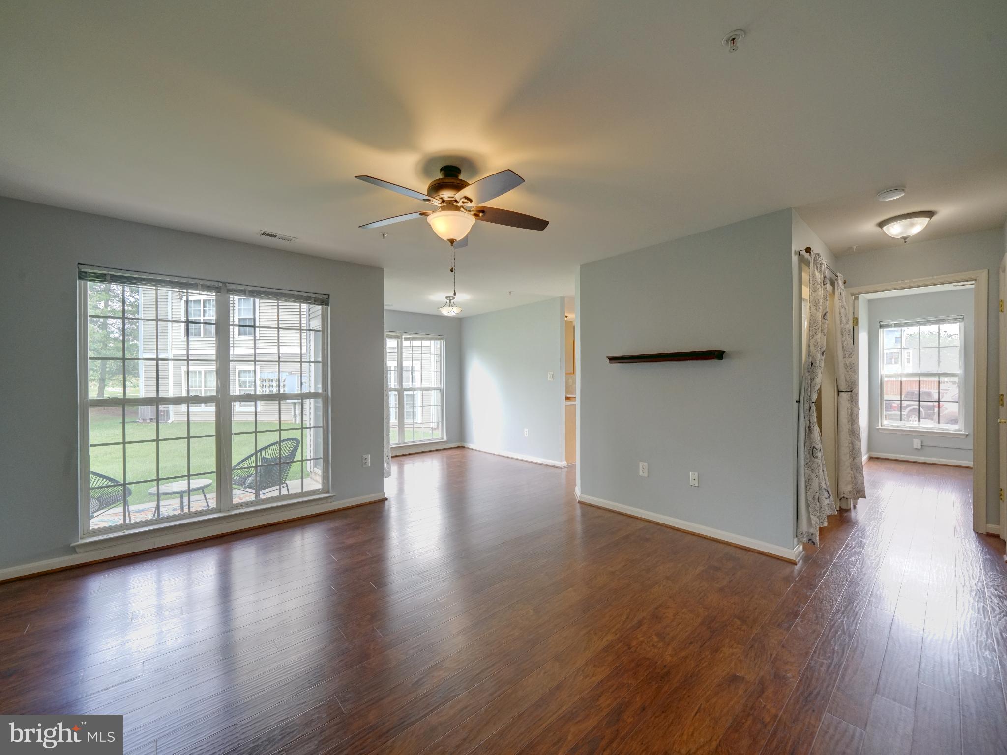 Available immediately! 2 bed, 2 bath, ground floor condo in Ballenger Creek. This 1199 sq ft model has a bump-out room adjacent to kitchen that can be used as a sunroom, breakfast nook, family room or home office. Large living room with ceiling fan and separate dining area with sliding glass door door to private balcony overlooking rear courtyard. Updated kitchen with stainless steel refrigerator, stove, built-in microwave, and dishwasher with corian counters and pantry. Additional pantry / storage closet with separate freezer. Large primary suite with attached bathroom and walk in closet. Primary bath updated with glass vessel sink, wood vanity, updated mirror and lighting. 2nd bedroom adjacent to 2nd full bath and laundry closet. Ceiling fans located in both bedrooms, living room and bonus room. LVP hard surface flooring throughout with lots of natural light. Full sized front loading washer & dryer in unit. Storage room located off of foyer with storage shelves and coat rack. Water and Condo/HOA fees included in rent. Secured (locked) entrance in building with interior access to front door of condo without any stairs. Plenty of parking including 1 assigned space directly in front of the building. Community has tennis courts, playground and open common area space. Convenient access to Routes 270, 70, 15, the MARC Rail to DC, shops, dining and Downtown Frederick. Frederick County Connecter Transit stop is within walking distance for the Cawley Drive stop on the 10 Mall-to-Mall Connector line.