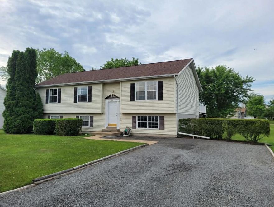 Welcome to this well-maintained split foyer home located in the desirable Edgewood East neighborhood of Bealeton, Virginia. Situated on a spacious corner half-acre lot, this charming 3-bedroom, 2.5-bath home offers the perfect blend of space, functionality, and small-town appeal. Step inside to find a warm and inviting layout with spacious living areas, ideal for both everyday living and entertaining. The kitchen features ample cabinetry and workspace, flowing seamlessly into the dining and living areas for an open, connected feel. Situated near the dining room, the walkout deck (complete with new PVC railing) provides an optimal place to relax and enjoy the beautiful views of the expansive backyard. Upstairs, you’ll find the hallways adorned with beautiful wood chair rail molding, brand new LVP flooring throughout the upper level, and new carpet in all upstairs bedrooms - creating a fresh, modern feel. Generously sized bedrooms provide comfort and flexibility, while the primary suite allows for its own private retreat with en-suite bath and ample closet space. The lower level features a partially finished basement with a versatile layout, including a carpeted entertainment area, a vinyl floored mud room/kitchenette with sliding glass door access to the patio, a convenient half bath, and a dedicated laundry room. A large unfinished storage space with exterior access provides additional flexibility and functionality. With its generous lot size, thoughtful updates, and inviting layout, this home is a great opportunity in a quiet, established community.