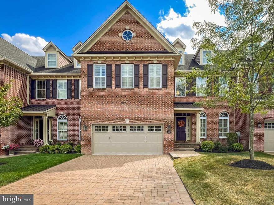 Absolutely magnificent home sits on a premium lot backing to open space in the small and sought after community of Delancey Court. This tastefully decorated and upgraded home has a wonderful open floorplan and is in turnkey condition. Enter the home through the foyer and formal living room featuring hardwood floors, extensive crown, chair and baseboard molding and half-moon windows allowing in generous amounts of natural light. Follow the hallway back to the heart of the home with a spectacular recently expanded and improved gourmet kitchen, expansive family room and elegant formal dining room. The kitchen is a cook's delight with hardwood floors, Wolf double wall ovens, JennAir 6 burner gas range, Subzero refrigerator/freezer, pendant and recessed lighting and large center island with barn style sink. The sellers added additional cabinets,  granite counters,  and a wine/beverage fridge to the kitchen eat in area. The kitchen flows nicely into the family room with a dramatic 2 story ceiling, hardwood floors, recessed lighting, a full wall of windows on the back wall facing the open space, and a cozy gas fireplace. The elegant and expansive formal dining room is open to the kitchen and family room and features extensive molding, a tray ceiling, and hardwood floors. The stairs leading to the 2nd and 3rd floors are hardwood or you can use the elevator with rich wood paneling. The 2nd floor has hardwood floors in the hall way and offers a large loft area that overlooks the 2 story family room. The laundry room is off of the hallway and there is a hall bath that is also shared and can be accessed by the 2nd bedroom. The sumptuous main bedroom has a tray ceiling, recessed lighting, 2 large walk-in closets, loads of natural light and a lovely ensuite bath with ceramic tile floors and surrounds, double bowl vanities, and a generous sized shower with multi heads and a bench seat. The 2nd bedroom has access to the full hall bath. Venture up to the 3rd floor and enjoy a large bonus room that could be an in-home theater, billiard room, workout area, office or so many more possibilities. Private paver patio with lovely landscaping looks out to open space and has a natural gas line for grilling. Paver driveway leads into a 2 garage with daylight doors, custom shelving and storage and a treated garage floor. Custom shudders throughout home. Control 4 Home Automation System is included. The clubhouse is a short walk away and offers an in-door pool, outdoor pool, ballroom, card and billiards room, library, fitness center, bocce court and much more. Truly wonderful home in impeccable condition.