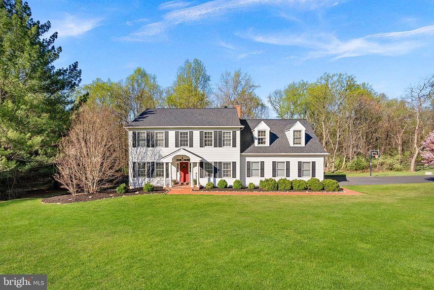 Tucked away on more than 3 private acres, this inviting center stair colonial offers the rare combination of space, comfort, and no HOA restrictions! From the moment you arrive, the setting feels like a retreat, peaceful, secluded, and surrounded by nature, with seasonal views of Evans Pond.
Inside, the home is warm and welcoming, with hardwood floors throughout the main level and thoughtfully designed spaces that balance everyday living with effortless entertaining. The gourmet kitchen serves as the heart of the home, featuring stainless steel appliances, new granite countertops, custom inset cabinetry, and a generous walk-in pantry. It opens seamlessly to a cozy breakfast room and family room, creating an easy, connected flow for gathering with family and friends. Formal living and dining rooms provide additional space for hosting, while a private office, updated half bath, and a true mudroom off the three-car garage add both convenience and function.
Upstairs, four spacious bedrooms offer comfort and flexibility, including a serene primary suite that overlooks the private backyard. This retreat is complete with its own wood-burning fireplace and a beautifully updated bath featuring a soaking tub, separate shower, and barn door accents. Two large closets provide ample storage, making the space as practical as it is relaxing.
The walk-out lower level extends the home’s living space, offering room for recreation, work, and storage. With a second office area, open space for games or gatherings, and a large unfinished area with laundry and additional storage, it adapts easily to your needs.
Outdoors, the property truly shines. The fenced backyard is perfect for pets, play, or even a small hobby farm. The back deck is perfect for grilling or enjoying the peaceful views. 
No need to worry about major repairs, the sellers have installed two new HVAC units in 2020, replaced the roof in 2023, purchased new washer/dryer in 2021 and replaced the dishwasher in 2024. Siding was painted and repaired in 2026. New well pump 2025. Septic pumped in July 2024. 
With plenty of room to roam and a setting that feels worlds away this home is still close to wineries, breweries, Lucketts Community Center, downtown Leesburg or train to DC.