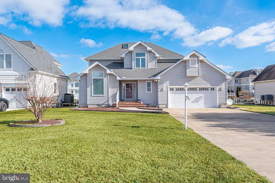 Gorgeous views of the Ocean City skyline await you, straight down the canal from your 80 feet of water frontage! A concrete walkway and brick entry porch welcome you to this Terns Landing contemporary home with a unique design. Load up your boat just steps from your back door at your private boat dock with motorized lift. Numerous outdoor living areas take advantage of the water views. Two balconies, rear deck, and a three season room leave plenty of room for outdoor entertaining. The kitchen was newly remodeled three years ago, including beautiful marble look floors, quartz countertop, stainless steel appliances, pantry with pullout shelves, built-in desk, and a breakfast area with access to the partly covered deck.  Two archways lead into the family room with hardwood flooring and a gas fireplace.  A large utility room, formal living and dining rooms, full bathroom, and a  two car garage with workbench and cabinets, are all accessed easily from the tiled entry foyer. The second level is brightened by two skylights, a conveniently located laundry area, two guest bedrooms, and a primary suite featuring a large walk-in closet, balcony access,  tiled bath with glass door shower and large whirlpool tub. There’s lots of storage space in the attic, accessed through a bedroom closet. Many  items have recently been replaced - the boat lift and HVAC units in 2021, the fireplace & water heater have been replaced, and the roof is 10 years old.  Make Terns Landing your new address!!