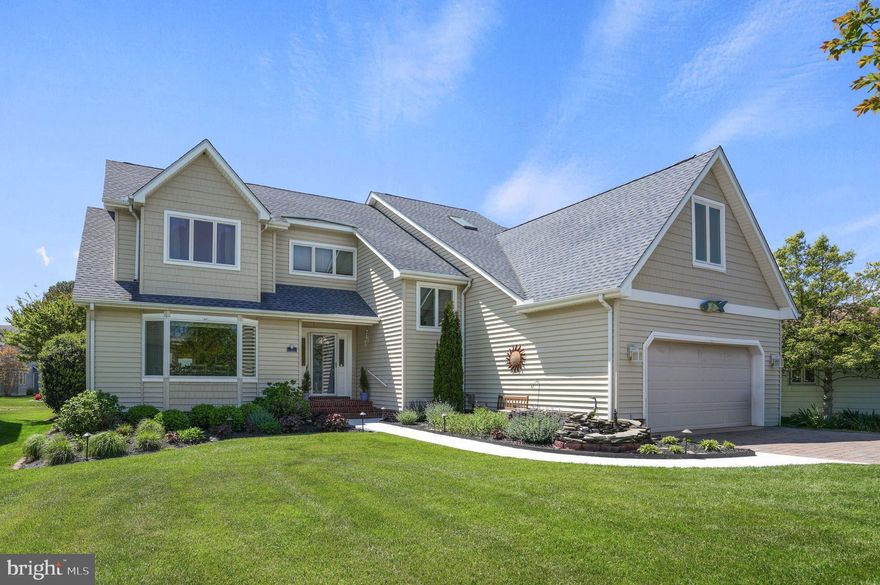 This pristine  home located in Wood Duck Isle I is perfect for entertaining or large family, offering the ideal blend of comfort, style, and location. The meticulously landscaped front yard features a tranquil koi pond, while the backyard showcases beautiful hardscaping, a charming gazebo, and serene views of Manklin Creek from the patio. Enjoy direct access to Wood Duck Park, where you can kayak, fish, or simply relax and take in the views. Inside, the bright and spacious layout is enhanced by new carpet and a cozy gas fireplace in the main living area. The first-floor primary suite features brand-new carpet, fresh paint, two large custom walk-in closets, and a private bath and opens to a newly added sunroom, complete with custom window treatments. The large eat-in kitchen offers a custom island with stunning countertops, a custom built-in window bench, and easy access to the separate formal dining room. The half bath on the main level and second floor full bathroom have been completely and tastefully remodeled. Upstairs, the generously sized bedrooms provide privacy for family members and guests, along with a versatile loft that offers additional living space. Additional highlights include abundant storage throughout, encapsulated crawl space, custom window treatments, a two-car garage, plenty of on site parking and an approximately five year old roof .  This is a must see - don't miss out!