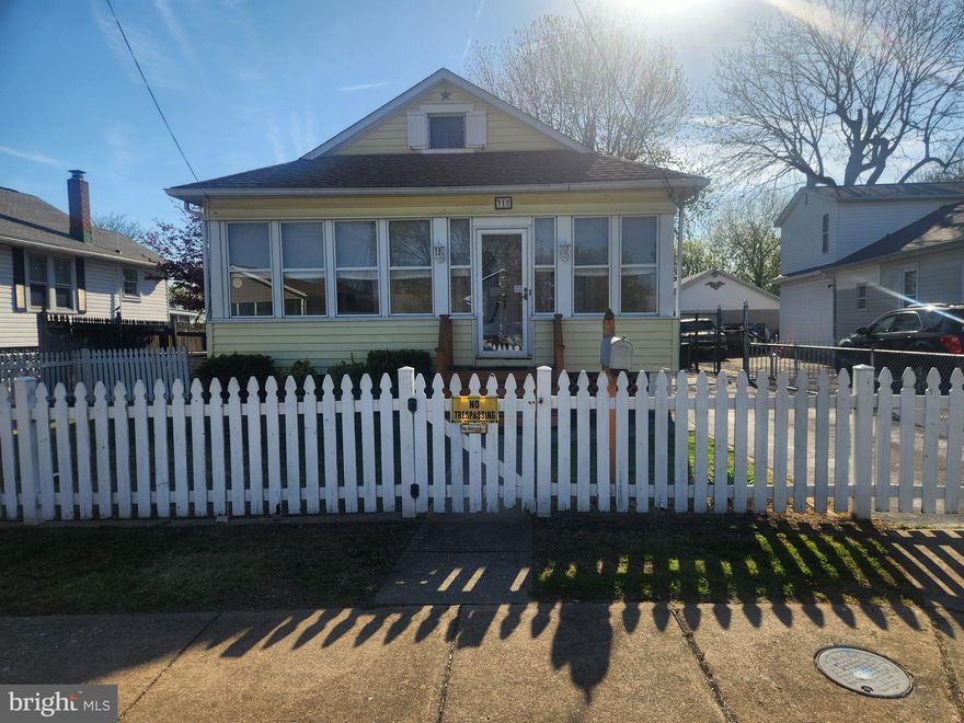 Welcome to this cute home in the heart of Essex. offering a fantastic opportunity to make it your own.  While the interior could use some cosmetic updating the price  reflects an opportunity to add your personal touches.  The roof was replaced in 2022, giving added peace of mind for years to come. Enjoy relaxing mornings or evenings in the enclosed porch, and take advantage of the partially finished basement for additional living or recreational space. The home also features convenient off-street parking and a level, fully fenced yard—perfect for outdoor gatherings, pets, or play. Being sold as-is, this property presents an excellent value for buyers looking to customize a home.  This property is close to the local elementary school and Coxs Point waterfront park.