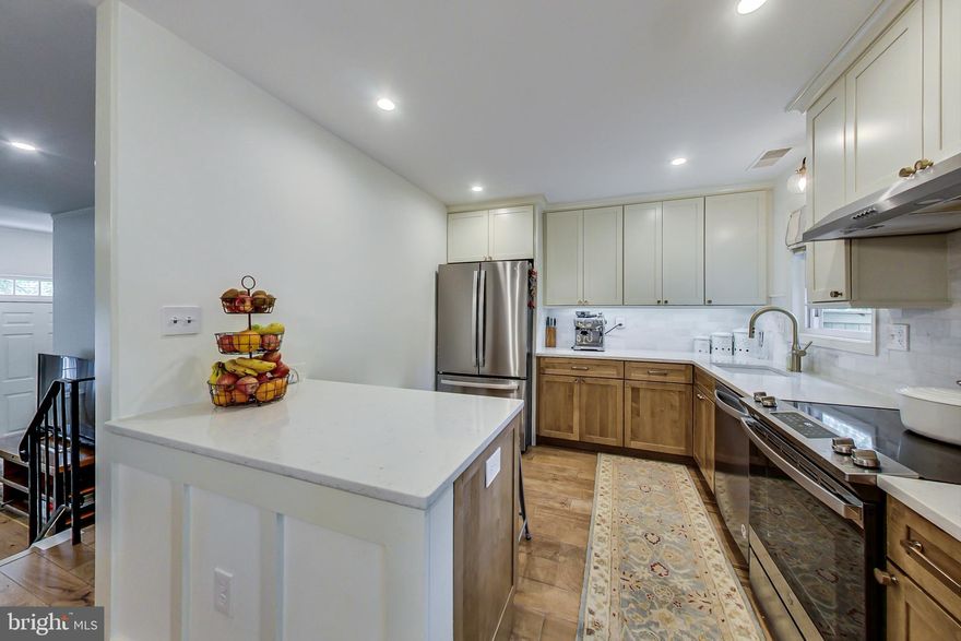 "Honey stop the car, this is it"  Welcome to 9872 Oakdale Woods Court. A must see, Well Maintained, Light Filled, Bright, Beautifully Renovated and Updated Townhouse in the Heart of Vienna. Offers 3 Bedrooms,1.5 Bath, 2 Assigned Parking and Fully Fenced Backyard.   Commuters Dream as the house is Walking Distance to Vienna Metro Station & Close to Route 29, Route 66, Parks, Recreations, Walking Trails, Restaurants & Shopping. Sought after Oakton Cloister Neighborhood with Mosby Woods Elementary & Oakton High School District.   Enter the Freshly Painted House into a Large Family Room with Beautiful Hardwood Floors, which takes you to the Amazingly Upgraded Gourmet Kitchen with Brand New Stainless Steel Appliances, High Quality Quartz Countertops, KraftMaid Maple Cabinets & Marble Backsplash. Dining Area Off of Kitchen. Newer (2020) Sliding Patio Door Leads to the Fully Fenced Backyard with a Brick Patio, Great Place for Outdoor Entertainment. Kick your shoes off, Relax and Enjoy Grilling & Sitting on the Patio after a long day of work. House Backing to the Common Area so Enjoy the Privacy.   Stairs will Lead you to the Upper Level, which offers 3 Bedrooms & 1 Fully Remodeled Full Bath. Nicely done Pergo Laminate Flooring in Bedroom and Upgraded Bathroom. Sellers have really taken care of this house. Come & See this Beautiful House and Fell in Love at the First Sight!  ******List of Recent Updates:  ********Sellers have Spent Over $60K in Upgrades*******  *Kitchen Complete Remodel November 2020 *Quartz Countertops  *KraftMaid Maple Cabinets  *Marble Tile Backsplash   *All Brand New Stainless Steel Kitchen Appliances February 2021 *Laundry room complete remodel 2021 * Fresh Paint throughout 1st floor 2021 May *All New Doors and Closet Doors New  2021    *Backyard 2020 *Sliding Patio Door 2020  *Full Bathroom 2019 November  *Half Bathroom 2021  *Hardwood Floors , Stairs 2017 *Upstairs Bedrooms Pergo Laminate 2017 *Water heater 2016  *Windows 2010