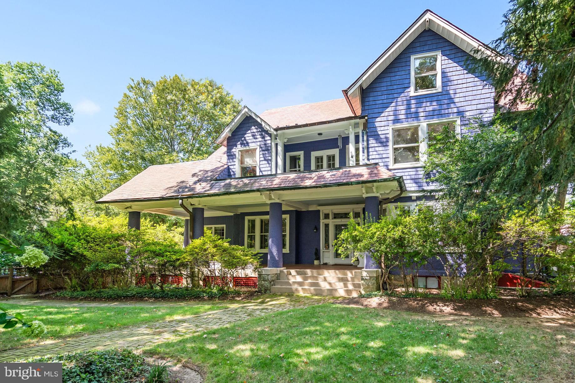 A truly rare opportunity in Chevy Chase Village! Welcome to 5 Chevy Chase Circle, an architectural gem known for its striking size, prime location, and captivating Arts and Crafts design lovingly known as "The Purple House". Originally built in the 1890s, this three-story residence, standing sentinel-like between Grafton Street and Magnolia Parkway, has a storied past that includes serving as a one-story schoolhouse, the Chevy Chase Land Company sales office, and later as the rectory for All Saints' Episcopal Church from the 1940s to the 1970s. As one of only two homes on the Circle — alongside the Corby Mansion — this frame and stucco masterpiece features wide overhanging eaves with brackets and robust, oversized porch columns. Buffering the home from the Circle is a charming parklet, with intersecting brick paths, providing a serene oasis amidst historic grandeur.
The home has a unique and private setting on a large, 14,904 sq ft lot. The expansive property is surrounded by mature trees and has been professionally landscaped for the utmost privacy and year-round color. It offers a wide variety of spaces to relax, play, and entertain - including a commanding front porch, side yards, a rear terrace overlooking the beautiful pool and hot tub, and a motor court and garage. Approaching the home off Chevy Chase Circle, you are greeted by the front porch and then enter the beautiful vestibule with French doors that open to the incredible foyer and breathtaking staircase. The main level of the home is spacious with high ceilings, original trims, hardwood floors and many grand rooms to live and entertain comfortably. A stately living room with coffered ceilings centers around the large and newly restored fireplace. This wing of the home also features a private office space leading to a separate terrace and a powder room off the foyer.
Exiting the foyer to the right, you can directly access the impressive separate dining room with another fireplace. You can also walk down the hall to the heart of the home - the spacious kitchen including a large cooking space, separate island, eat-in space for 10+ and a tucked away butler's pantry that circles to the dining room. Off the eat-in kitchen is a gorgeous family room that is bathed in light from incredible windows and includes a spectacular stone fireplace. The family room leads directly to the terrace overlooking the pool. A mudroom off the kitchen leads to the motor court and a detached two-car garage.
Upstairs you will find two more finished levels offering another 3500 square feet of living space. The second floor includes the primary suite with a large walk-in closet, a third wood burning fireplace, and private balcony along with an additional 3 bedrooms and 2 bathrooms. The top level includes a striking and spacious rec room with a fifth fireplace that could easily function as a playroom, library, or additional bedroom. This floor also includes two more bedrooms, landing area, storage, and another full bath. The lower level of the home offers over 1200 sq ft of versatile space and storage areas, another bathroom, laundry area, and a sauna. Recent updates to the home include two brand new Carrier HVAC systems installed on 06/25, rebuilding the main fireplace and chimney, and recently upgraded pool heater, pool refinishing, and filter system.
Chevy Chase Village is an historic community just over the DC/MD line. The Village’s tree-lined streets, brick sidewalks, and open parks, combine with walking-distance access to public transportation, shopping, schools, restaurants, the Chevy Chase Country Club, and theaters to offer the best of urban and suburban living. Chevy Chase Village has its own police force that patrols the neighborhood 24/7, package pickup while you are on vacation, handles all trash, recycling, and snow plowing, and it is all run out of the centrally-located Village Hall on Connecticut Avenue which is open to residents for events throughout the year.
